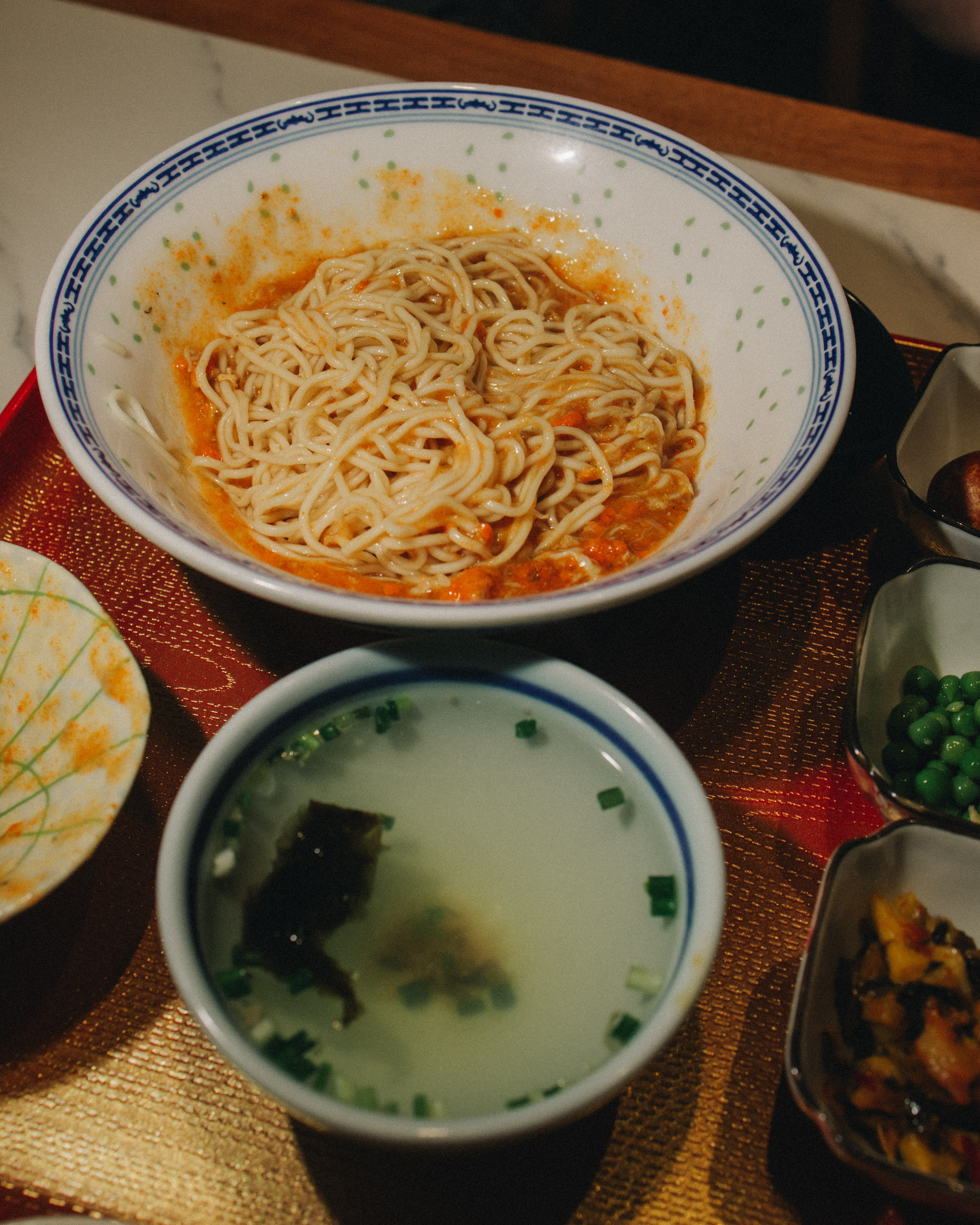 Male sailor from the ACS Independent team focused on steering his boat during the A Division race action.