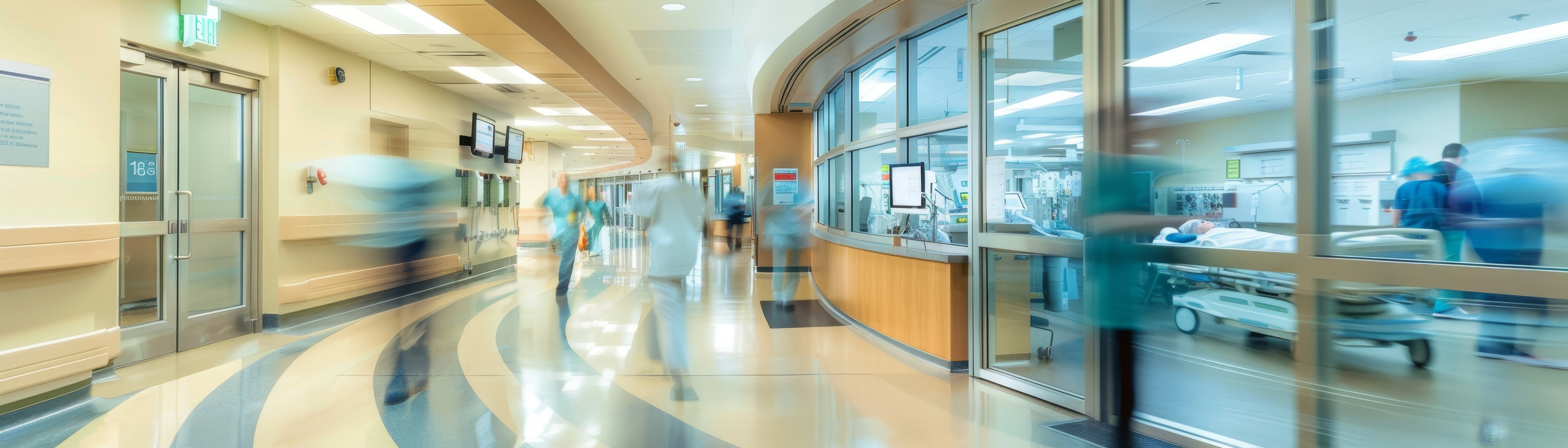 Spitalflur mit klinischem Personal und Bereichen für die Patientenversorgung, der die Servicegestaltung und -entwicklung durch geplante, kontrollierte und evidenzbasierte Servicebereitstellung über Teams hinweg darstellt.