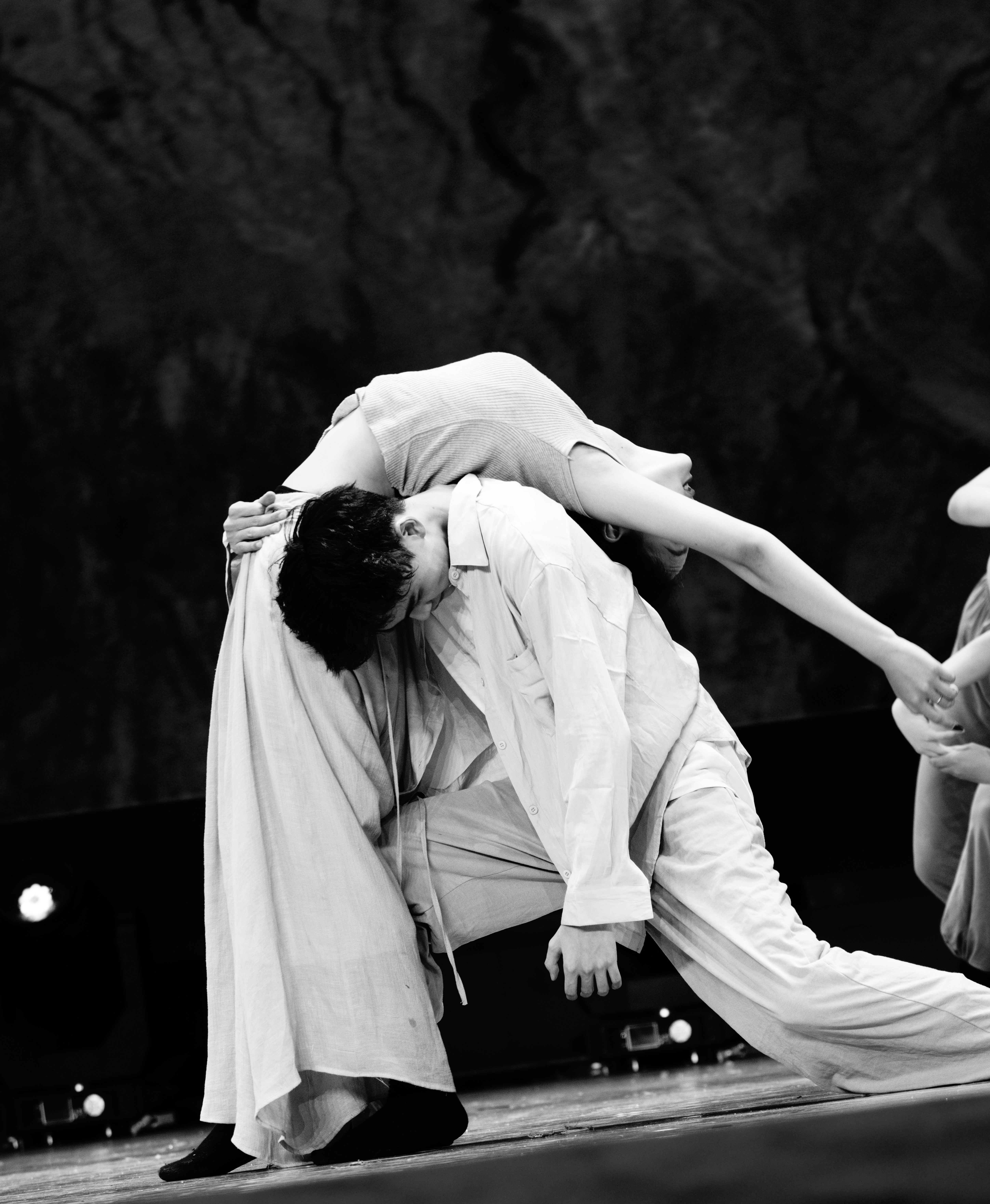 Two dancers in a dramatic pose on stage.