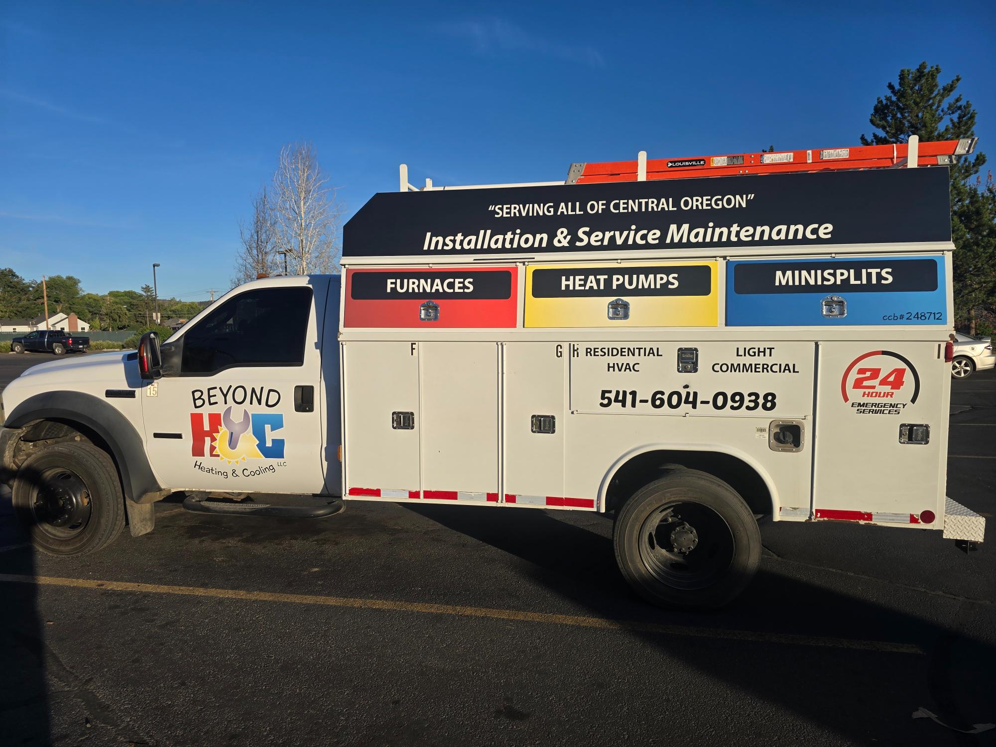 Beyond Heating & Cooling service truck with branding and contact info.