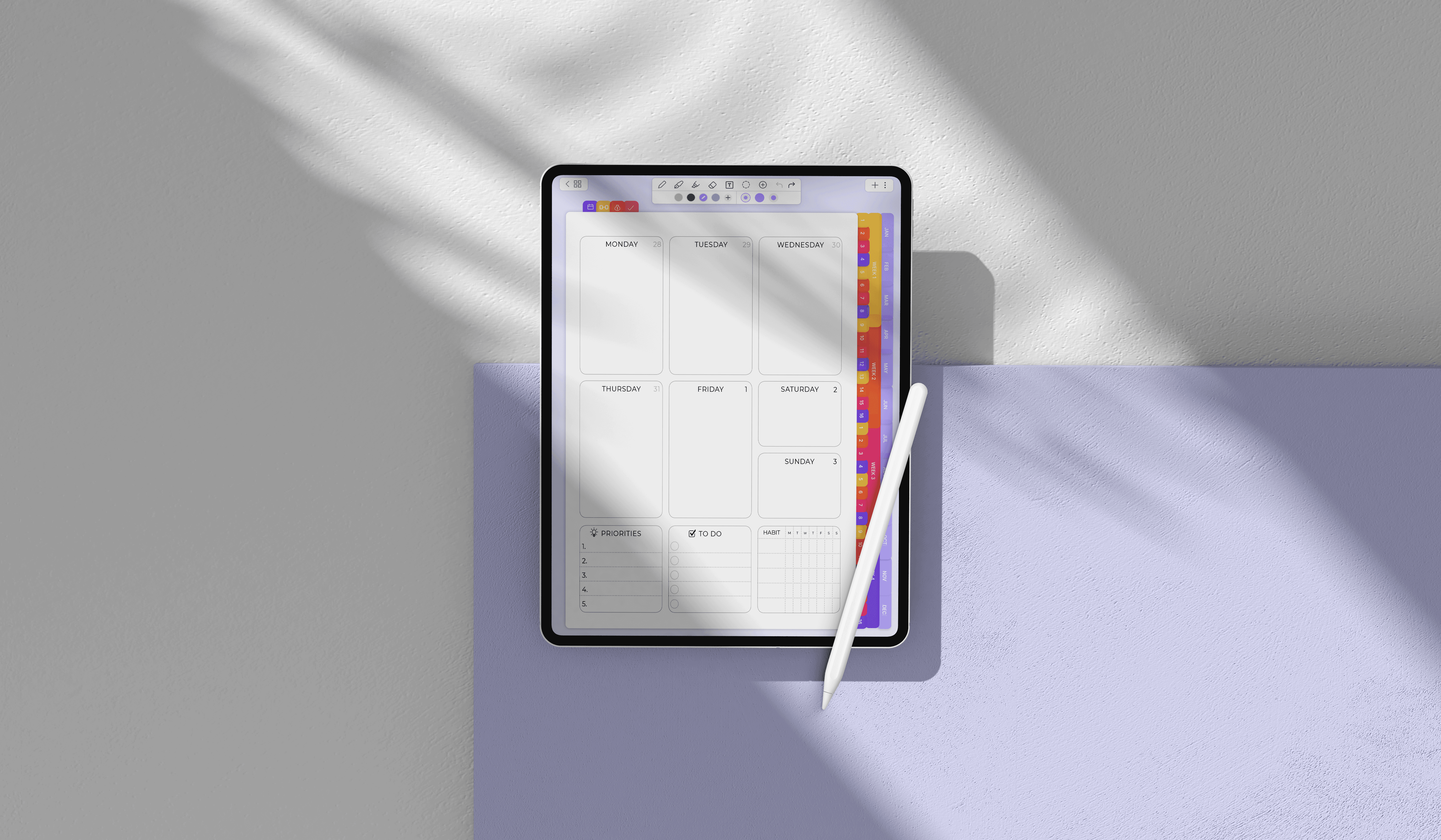 A woman in a colorful shirt sits at an outdoor table drawing on an iPad with an Apple Pencil.