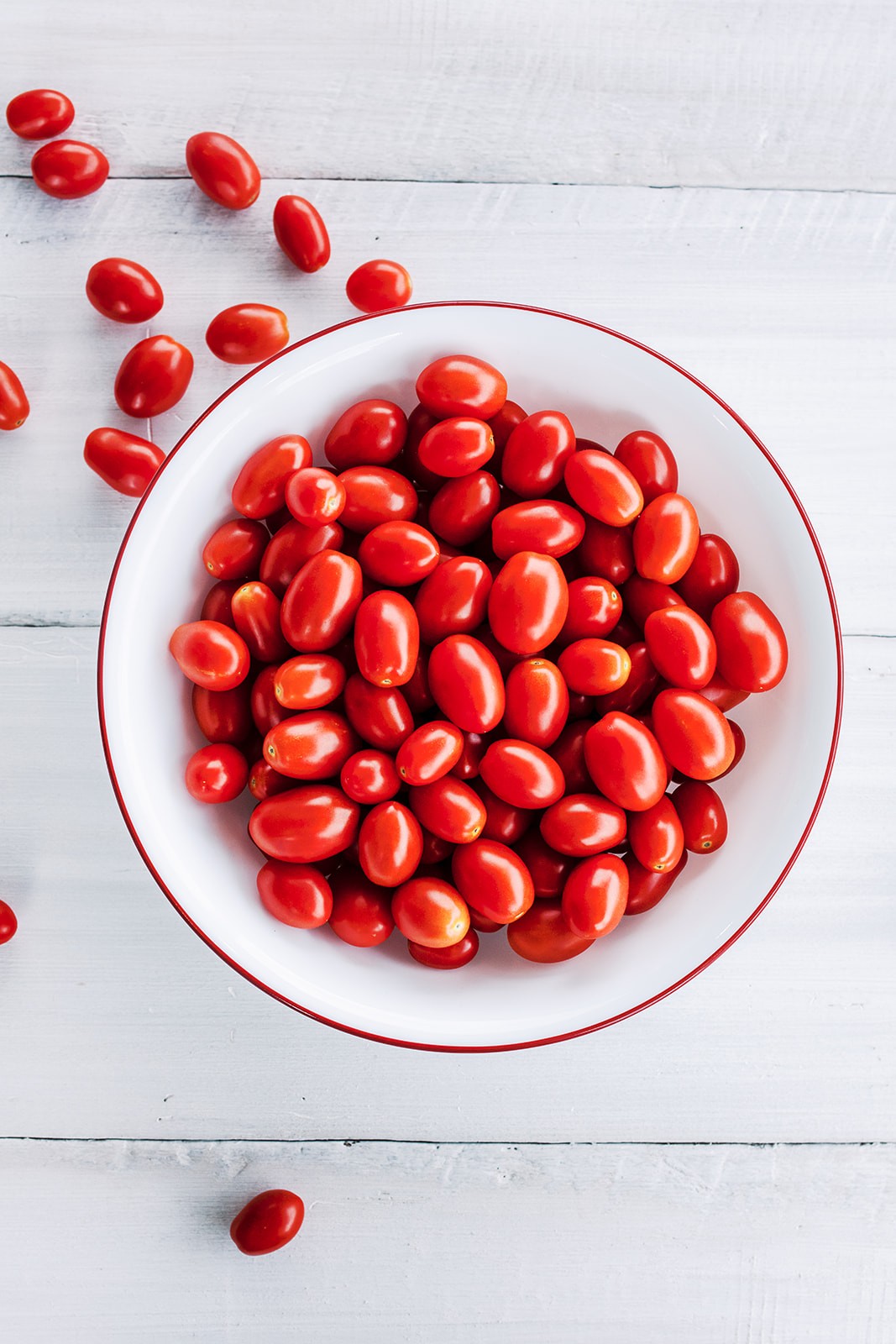 Bowl of fresh grape tomatoes displayed for wholesale buyers and food service professionals