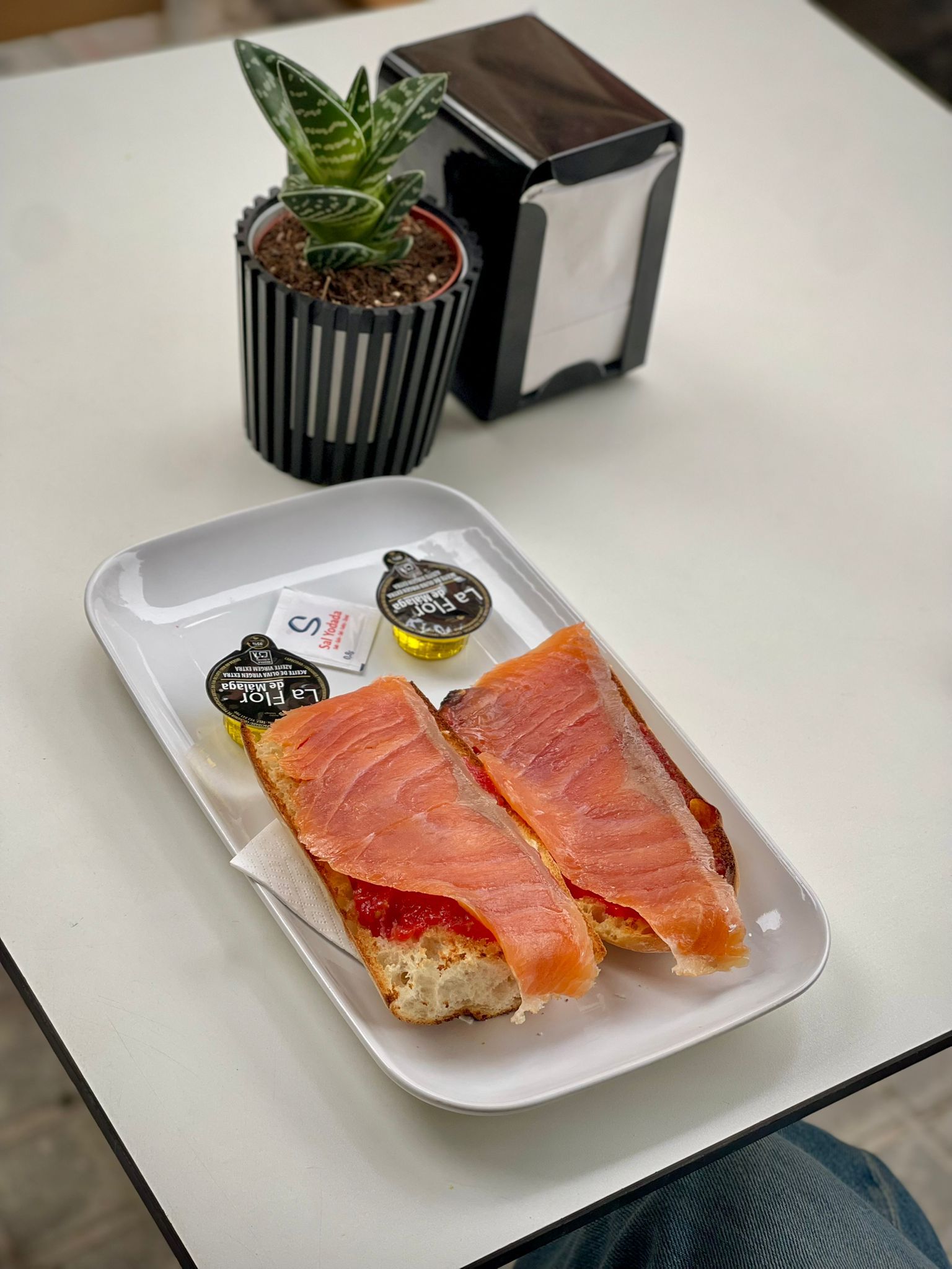 Bottles of olive standing on the marble counter
