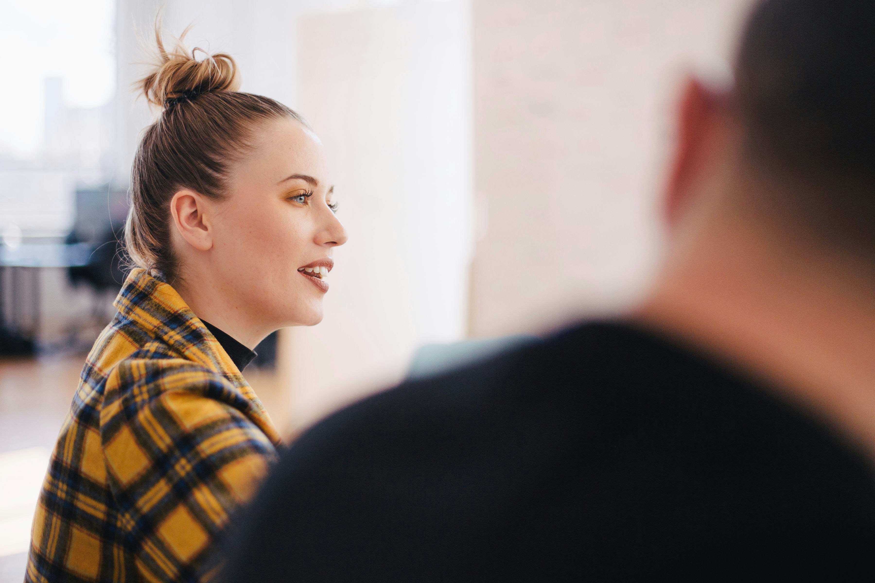 Team Member Smiling in Meeting