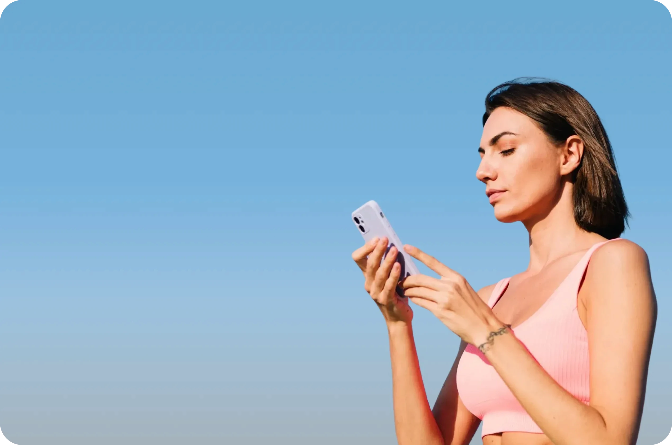 Woman with phone on blue sky background