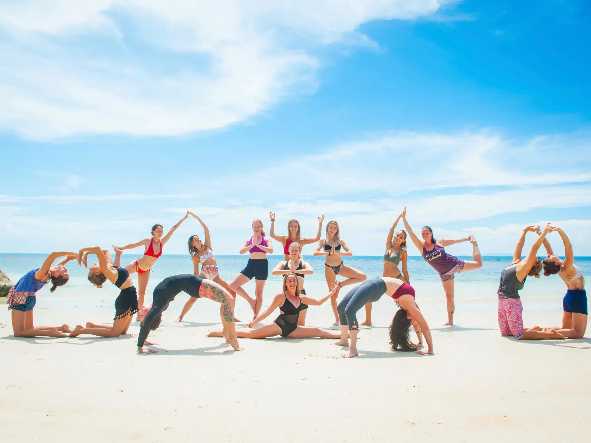 Spacious open-air yoga shala with panoramic ocean and mountain views set up with mats and props for teacher training classes at Ulu Yoga Bali.