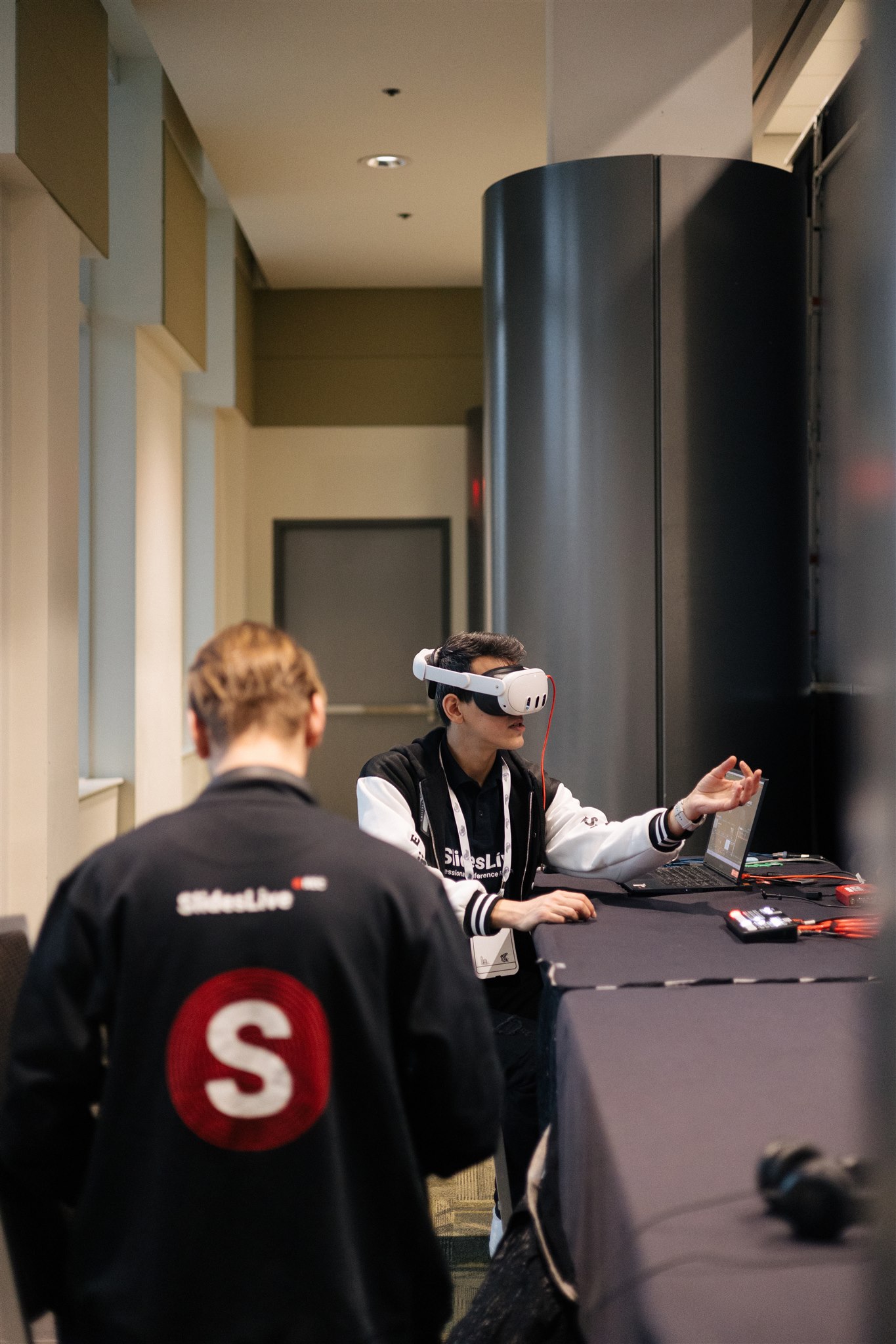 SlidesLive team working on-site during an event.