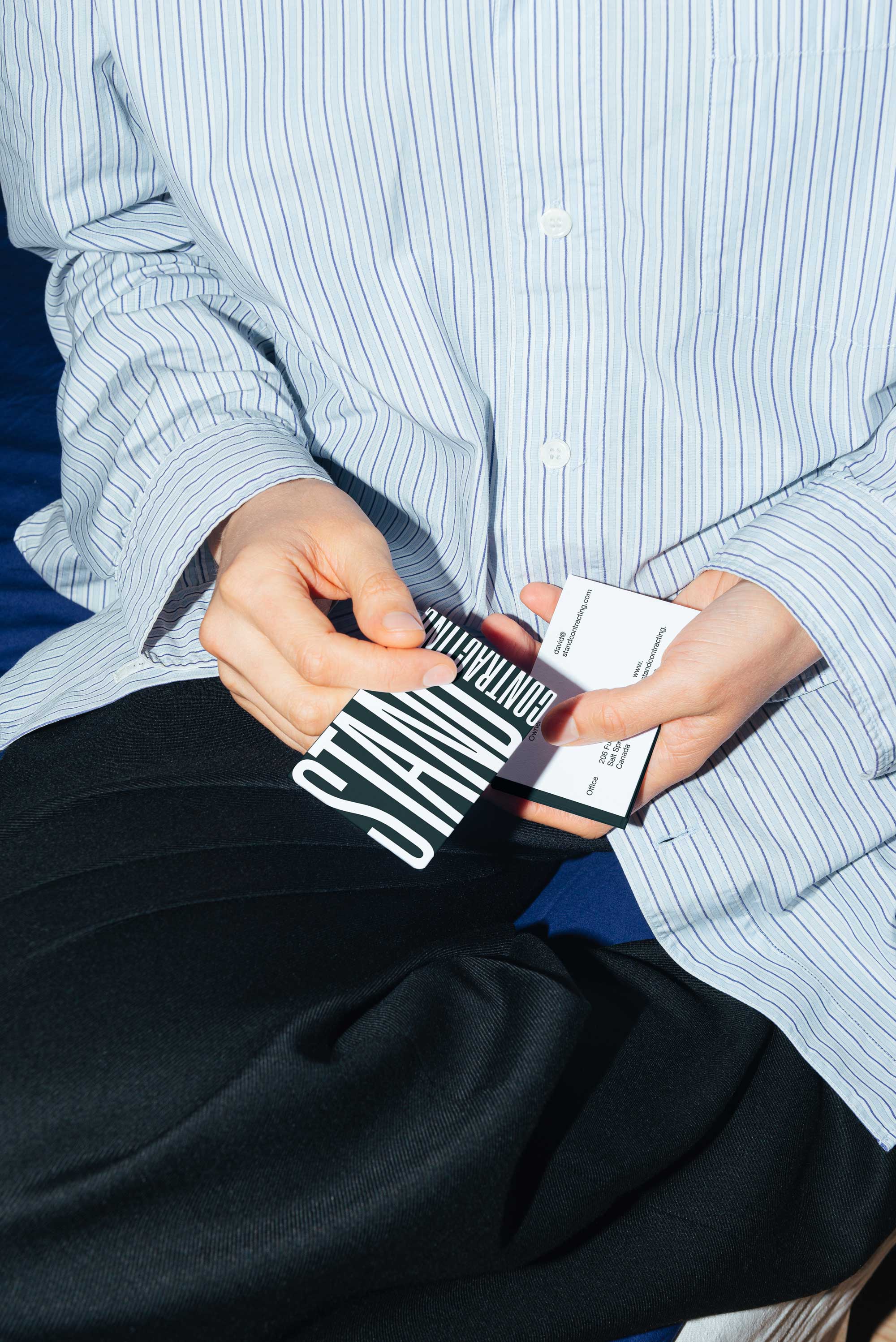 close up shot of someone holding business cards