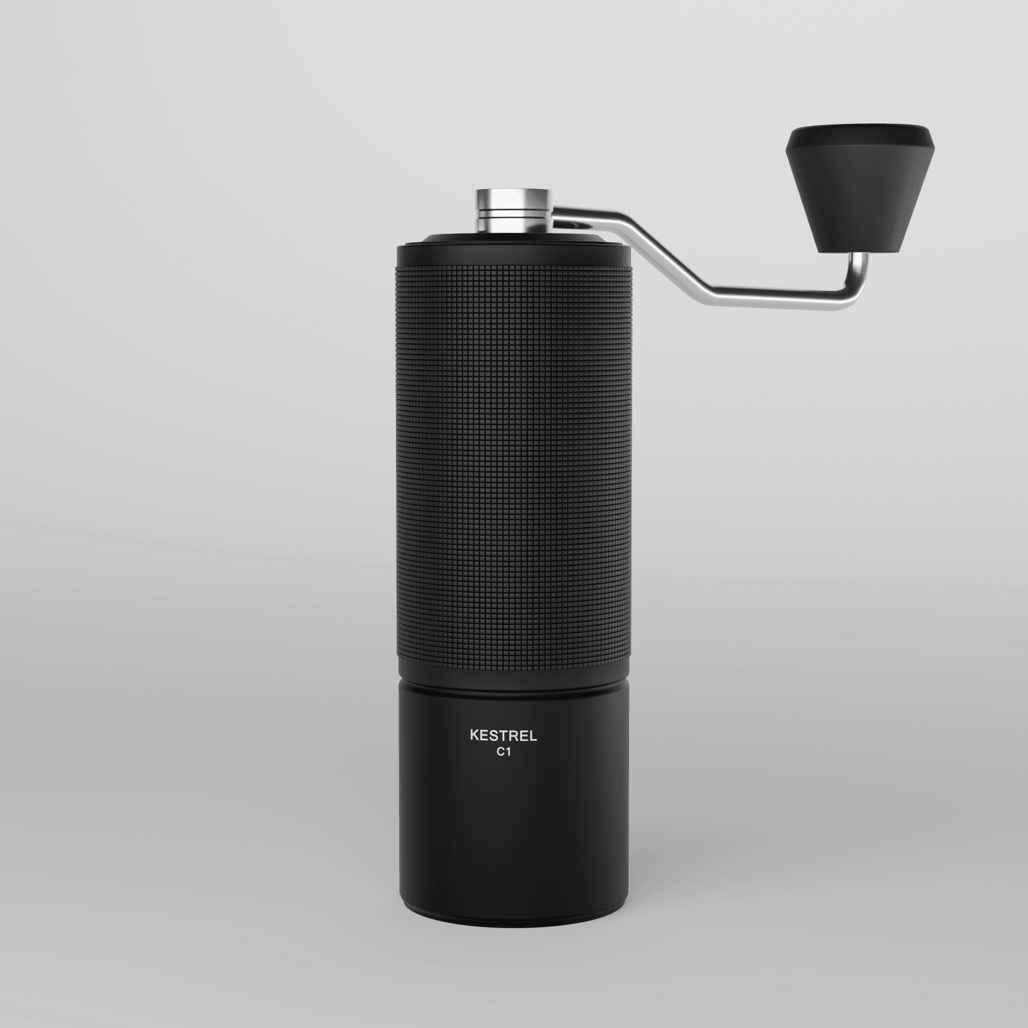 Front view of the matte black hand coffee grinder on a light gray backdrop, showing the full knurled grip, smooth lower body with engraved lettering, and the steel crank arm.