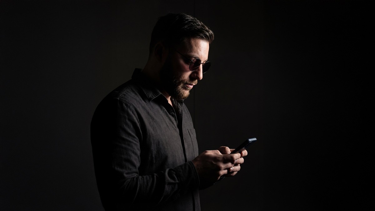 Michael Carter in a dark background