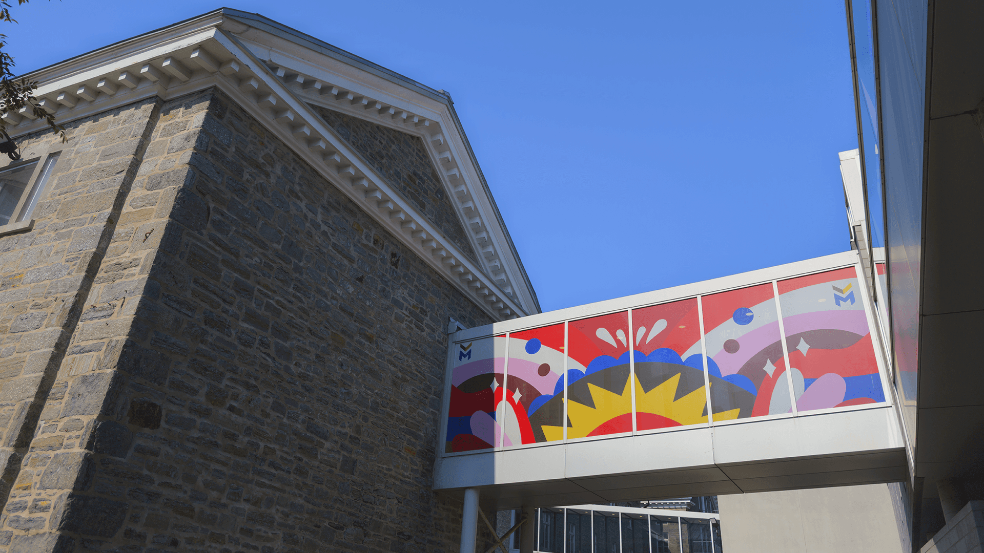 Streetside billboard with flyposters of the Batch.Works brand and illustrations