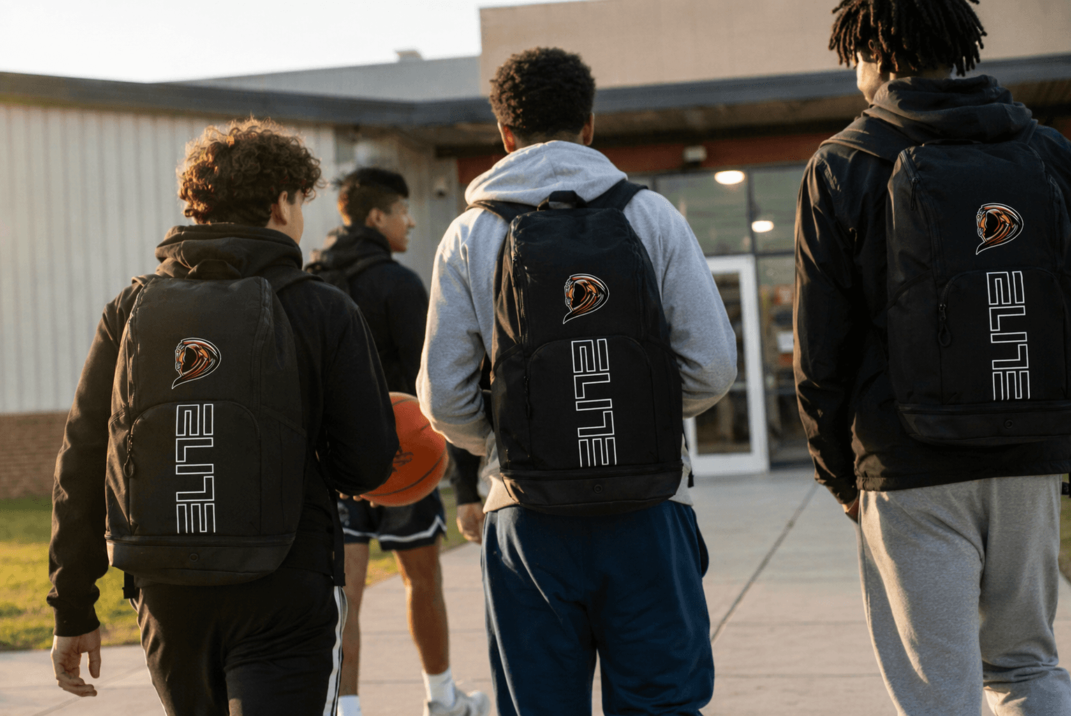 teen basketball players wearing a reapers back pack
