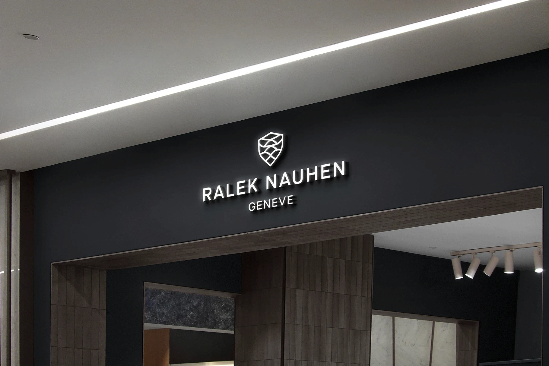 Luxury 3D store sign mockup with a white logo on a dark facade.