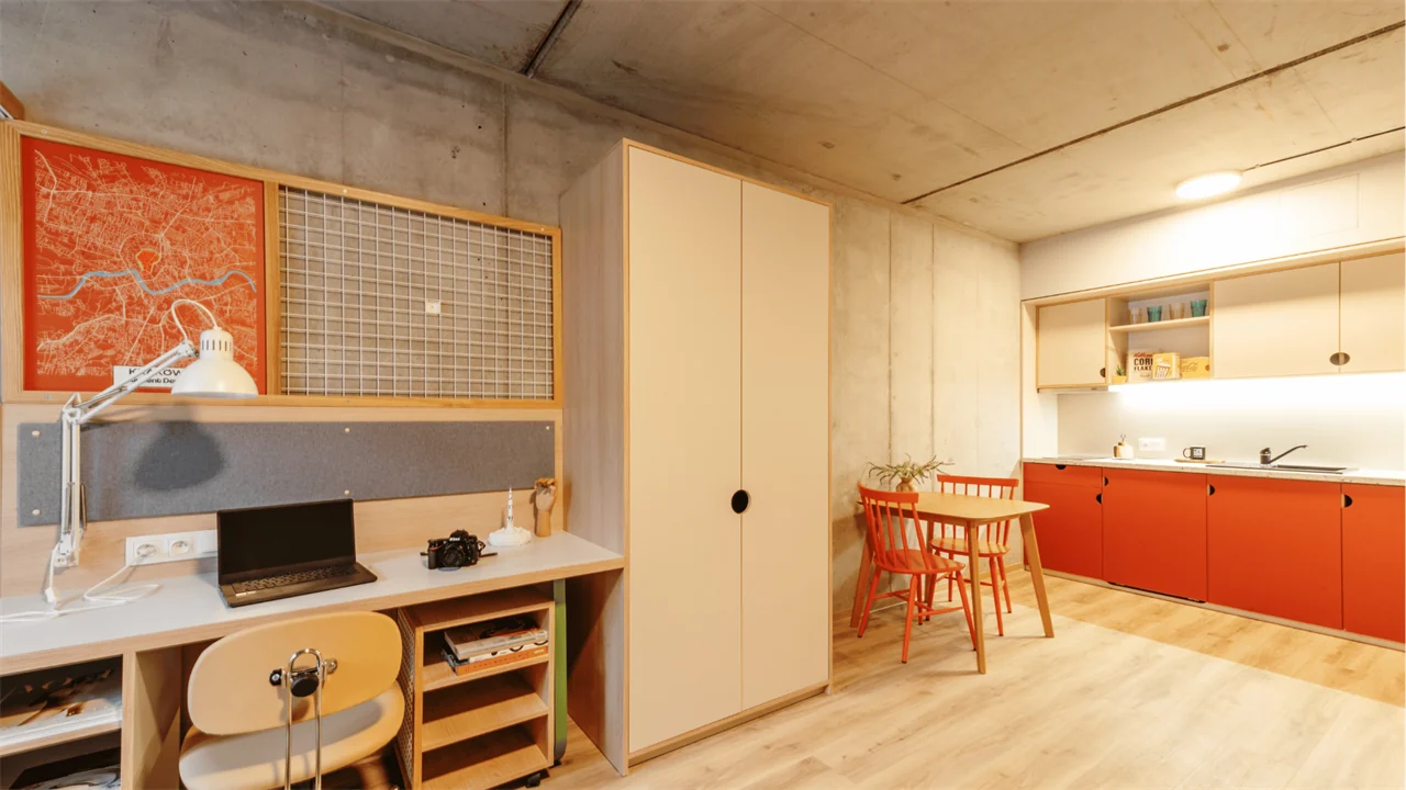 Student studio with kitchenette, dining table and study area in Kraków