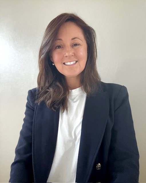 woman in red cardigan smiling
