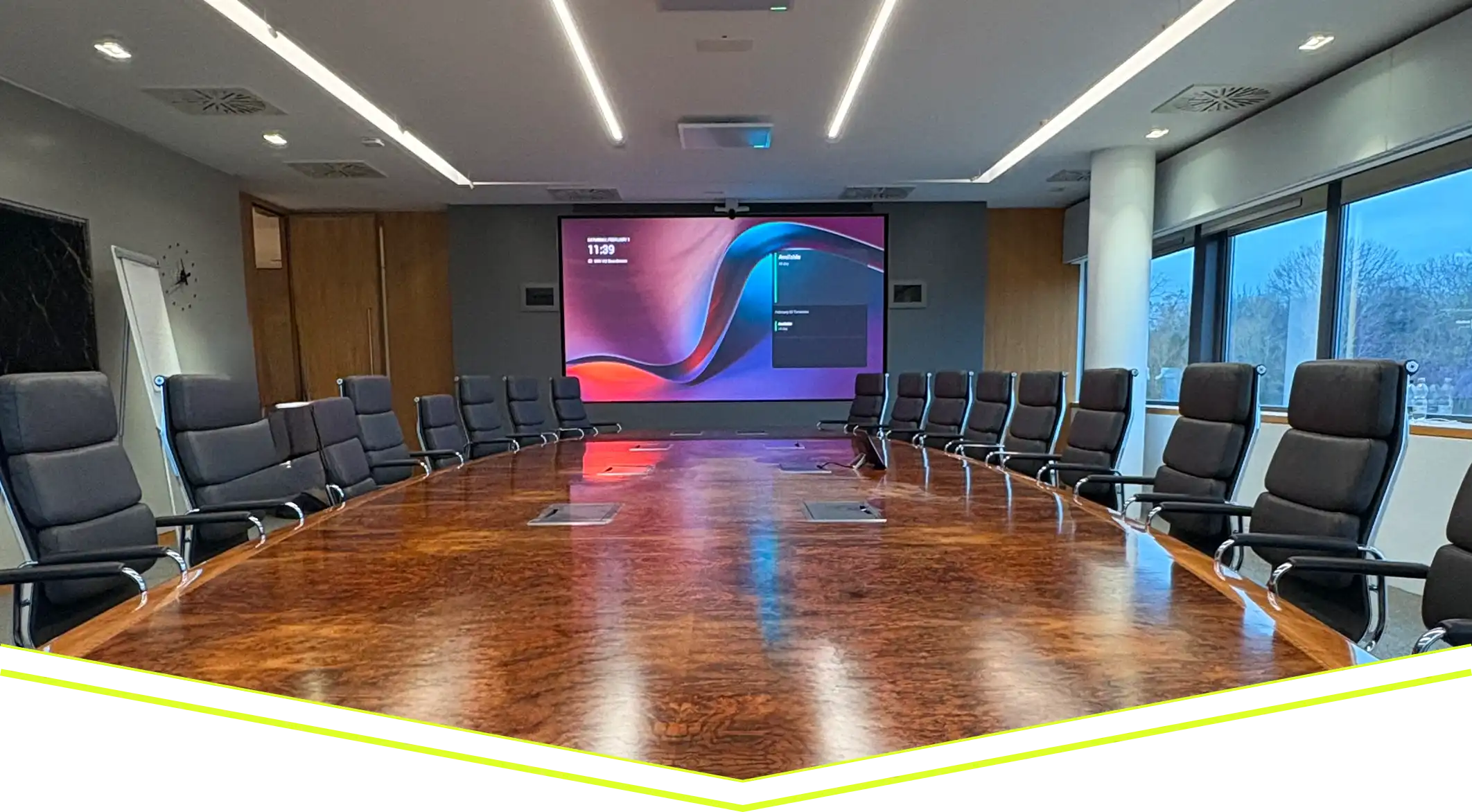 Corporate boardroom with large presentation display