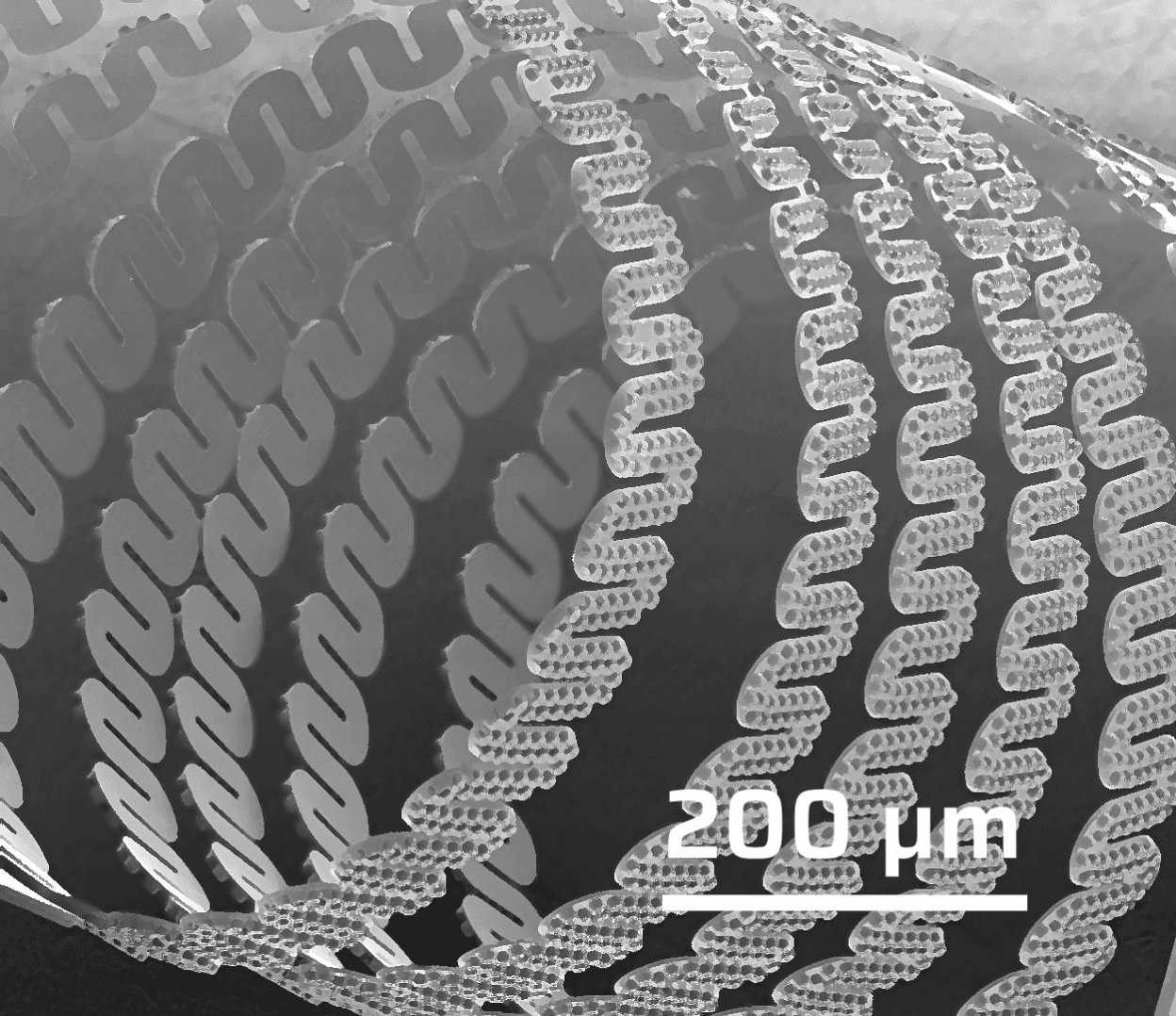 Close-up of a microchip or semiconductor component with parallel etched lines and circular nodes.