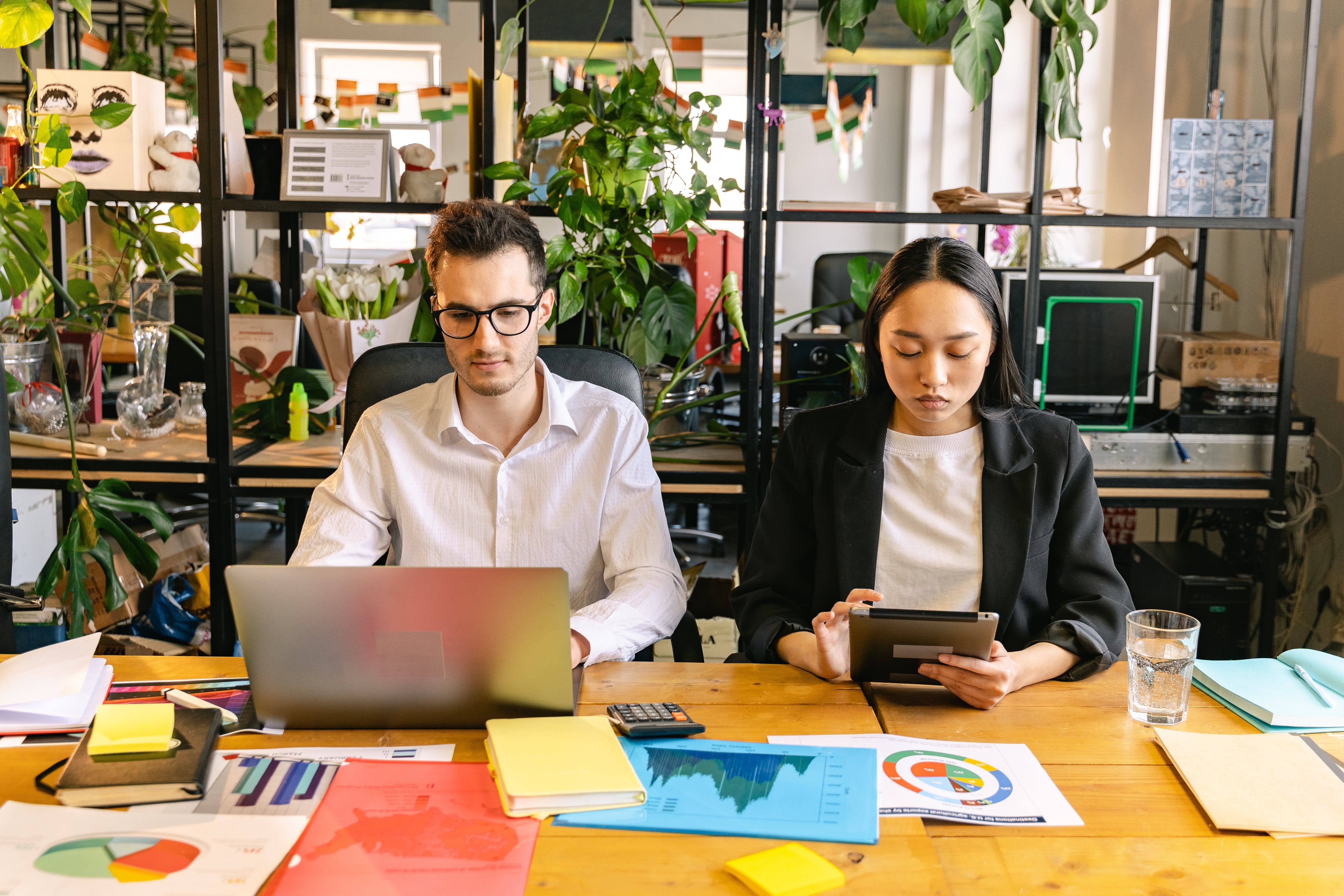 Man and woman working in the doing cold emails