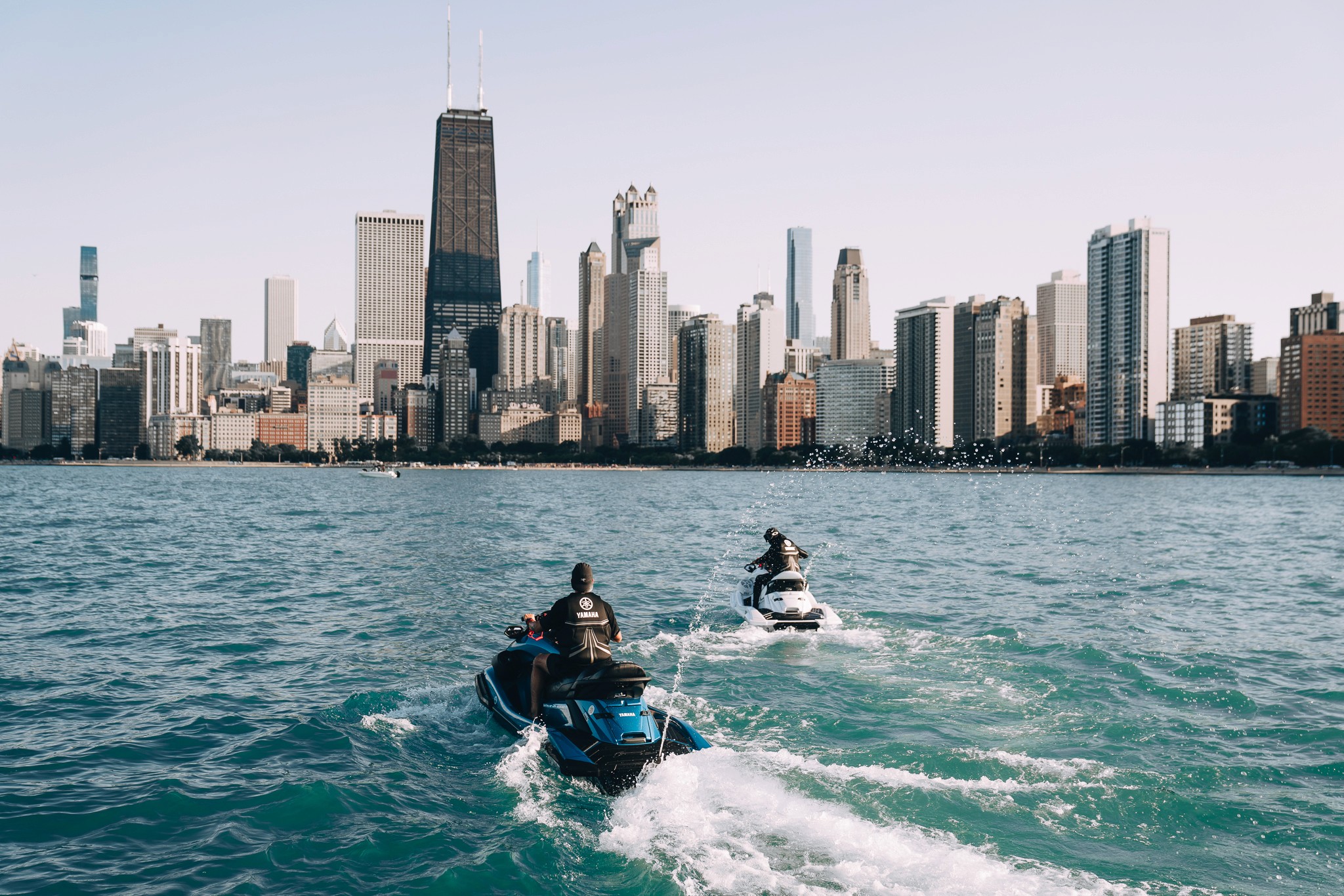 Chicago water activity scene with textured city horizon