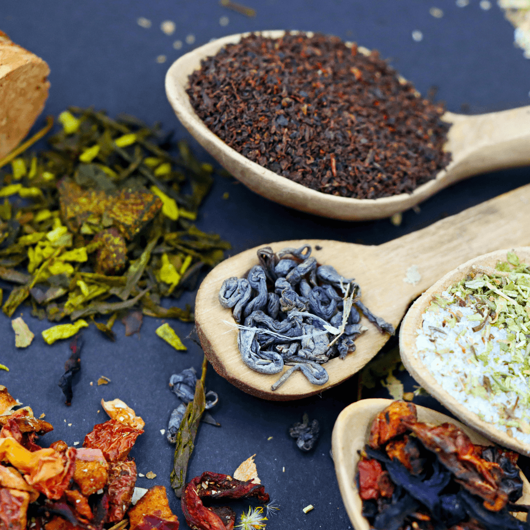 A small, dark flask is nestled among twigs and leaves on a forest floor, with a muted, mysterious ambiance.