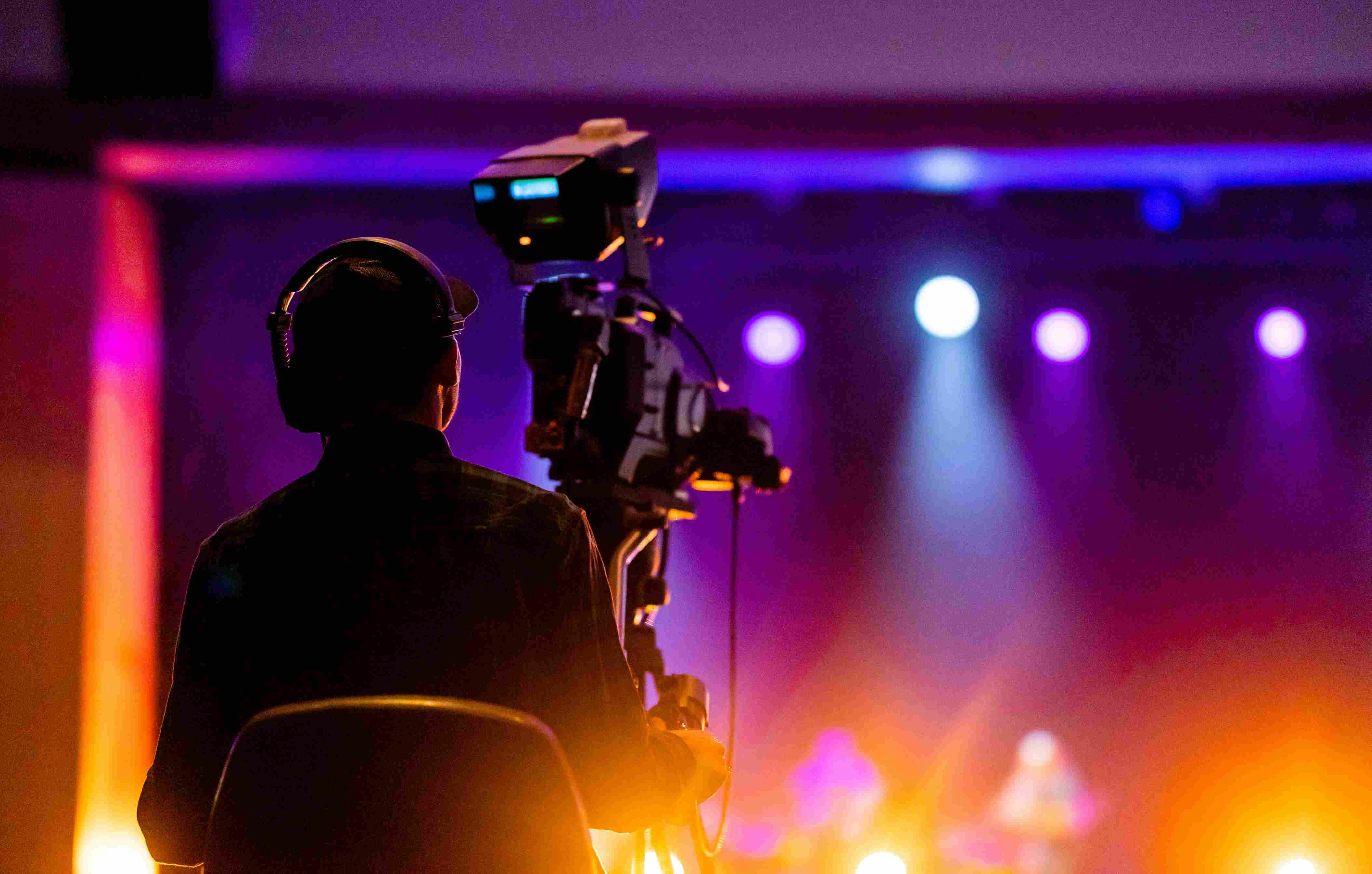 shot of a camera man filming a live event