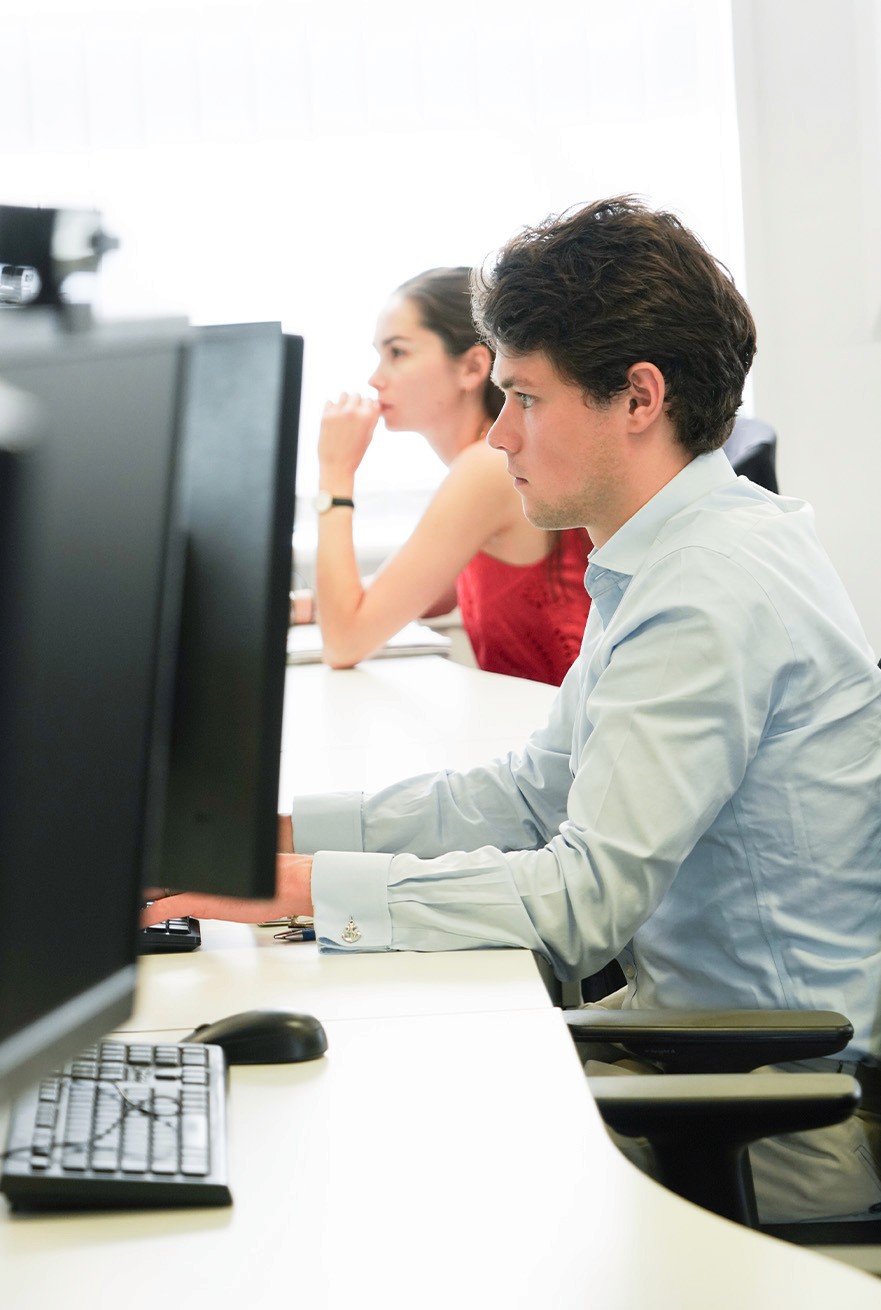 Hughes Price Walker actuarial team discussing trustee support and pension scheme funding work at their desks.