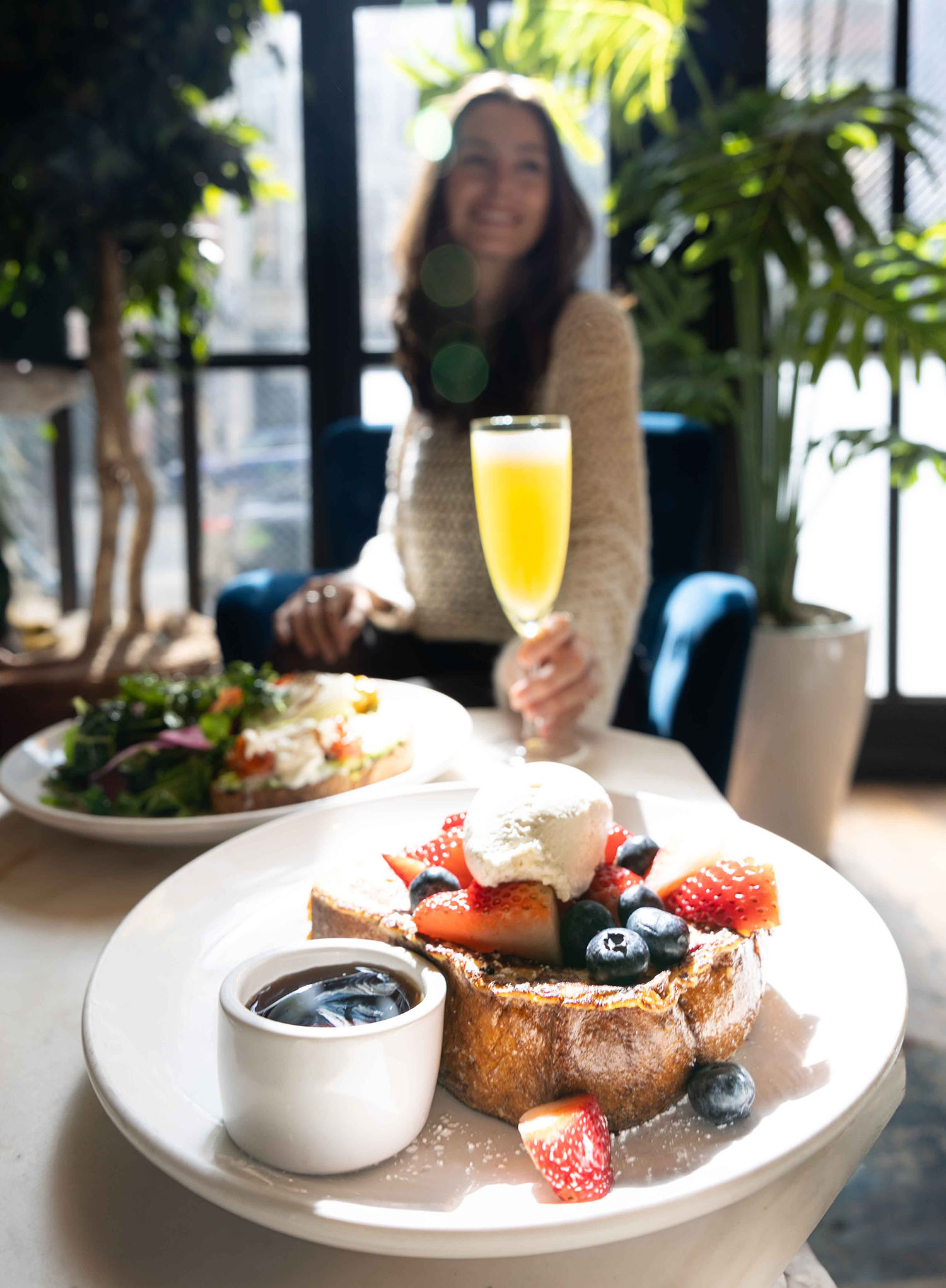 French toast topped with fresh strawberries, blueberries, and whipped cream served at Hubbard Inn in River North Chicago IL