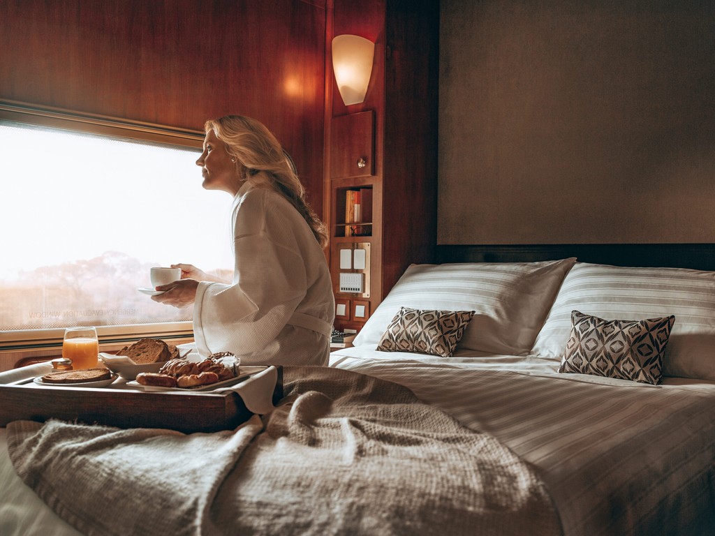 an aerial view of a baseball stadium with a city in the background