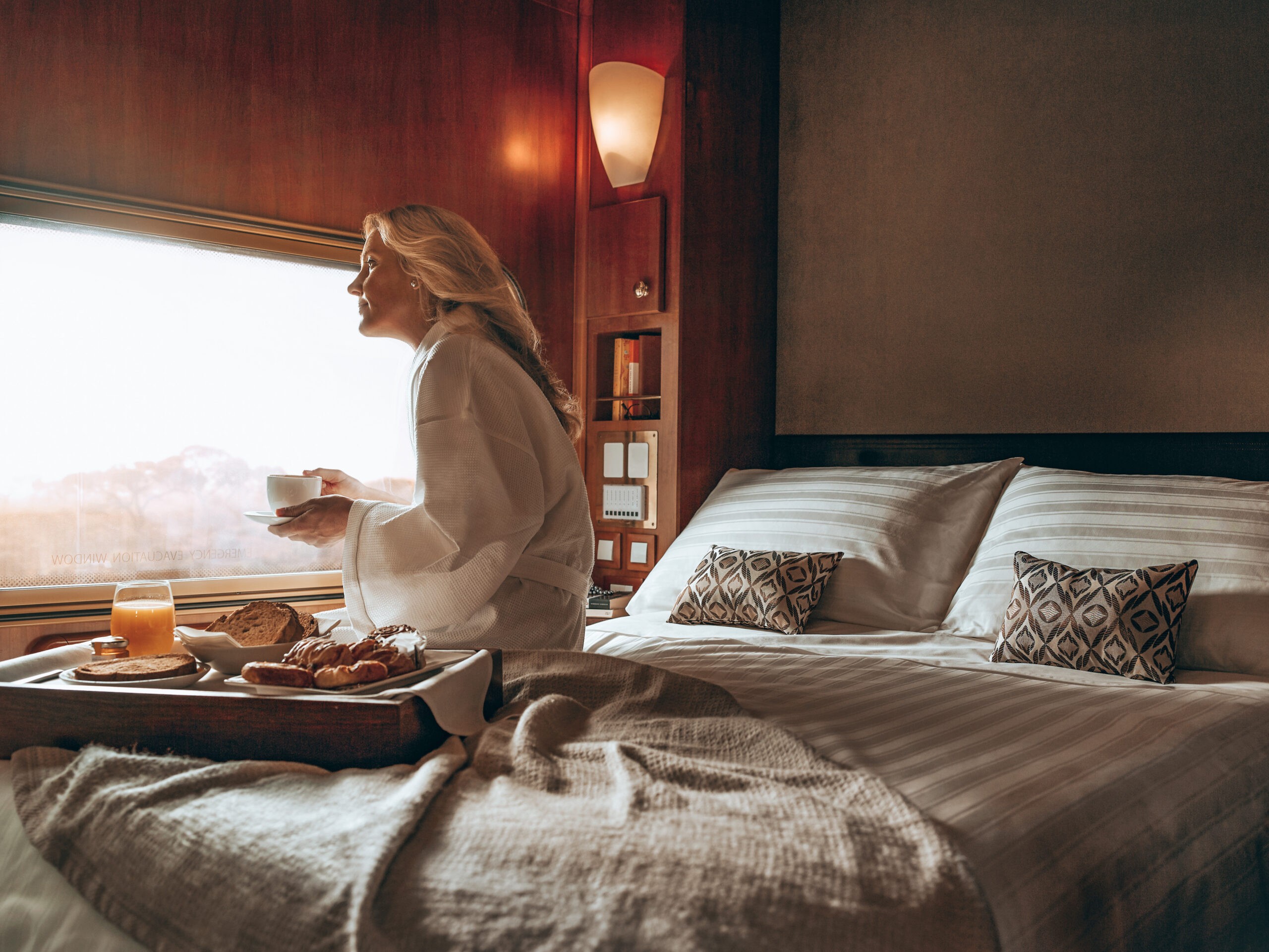 an aerial view of a baseball stadium with a city in the background