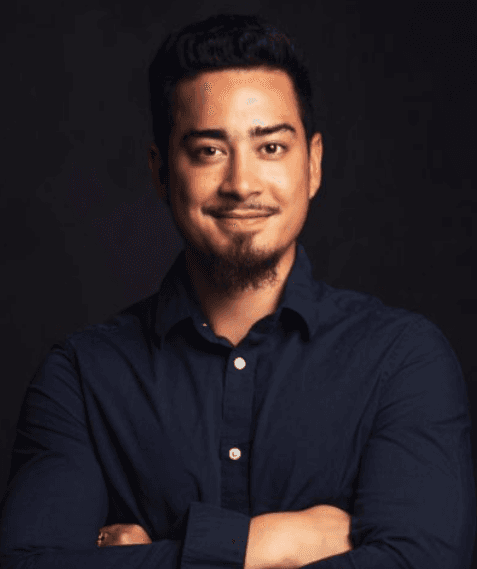 headshot of male in dark background