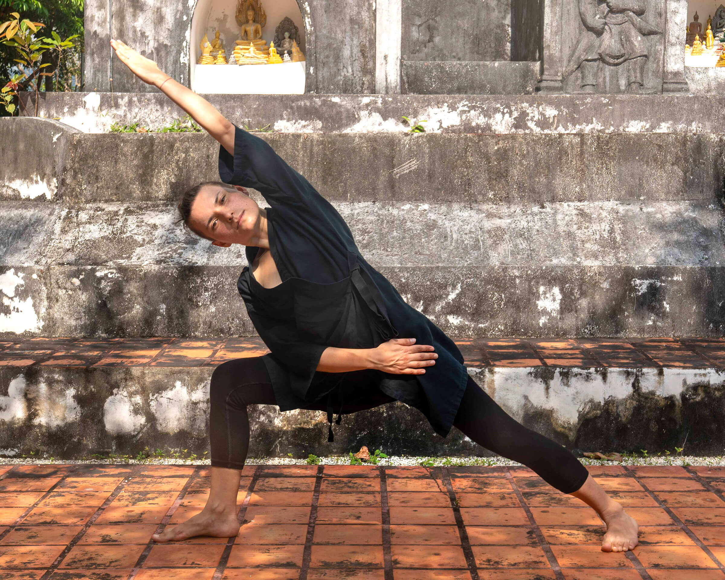 Man meditating in seated yoga pose with eyes closed