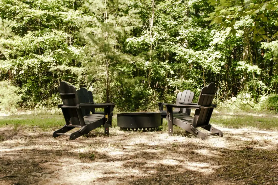 Adirondack chairs around a fire pit