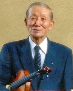 baby playing multicolored xylophone toy