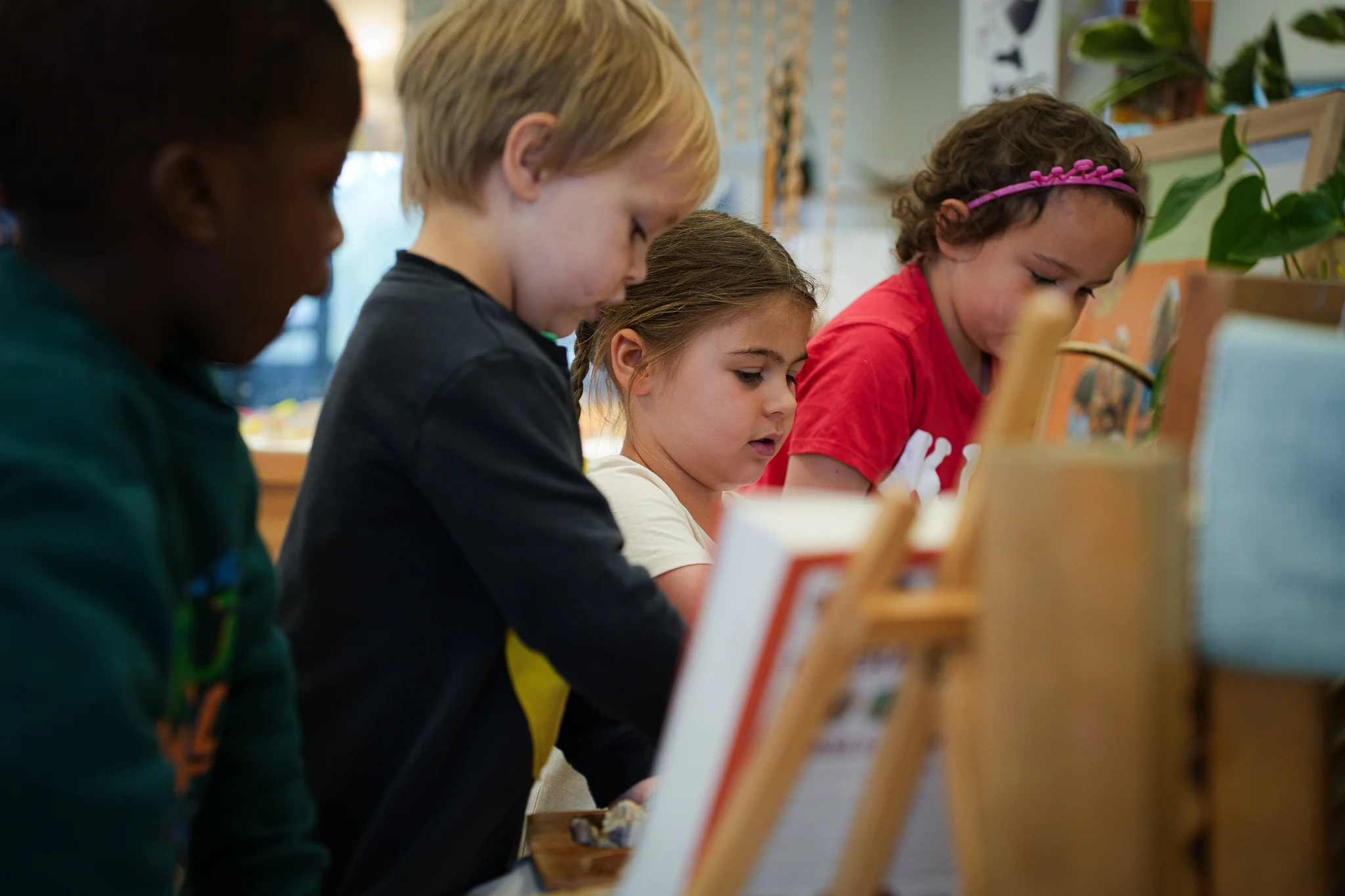 Group of children inside doing arts and craft