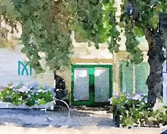 A person with short blonde hair holds a vintage camera.