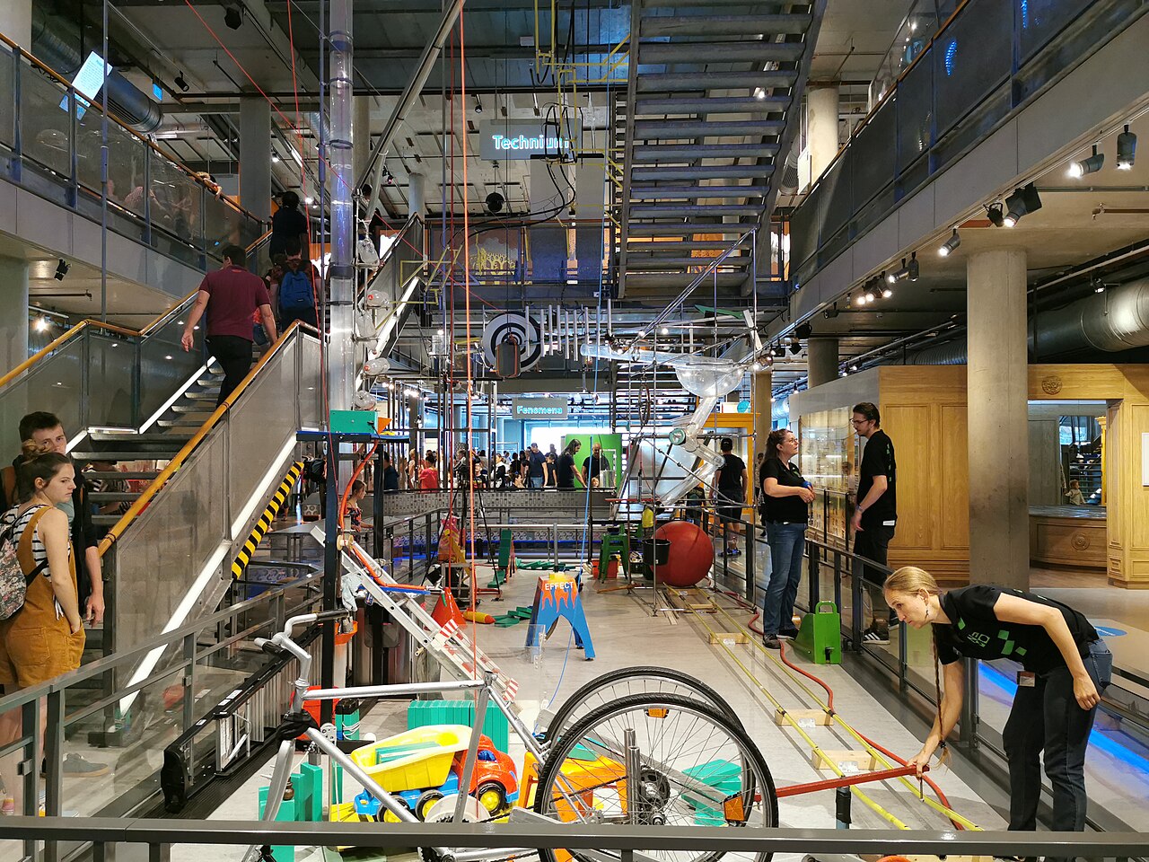 A busy exhibit on display with onlookers at the Nemo Science Museum in Amsterdam.