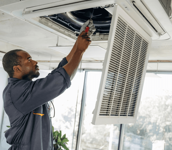 HVAC technician performing professional duct cleaning in a Mississauga home to improve airflow, remove dust buildup, and enhance indoor air quality.