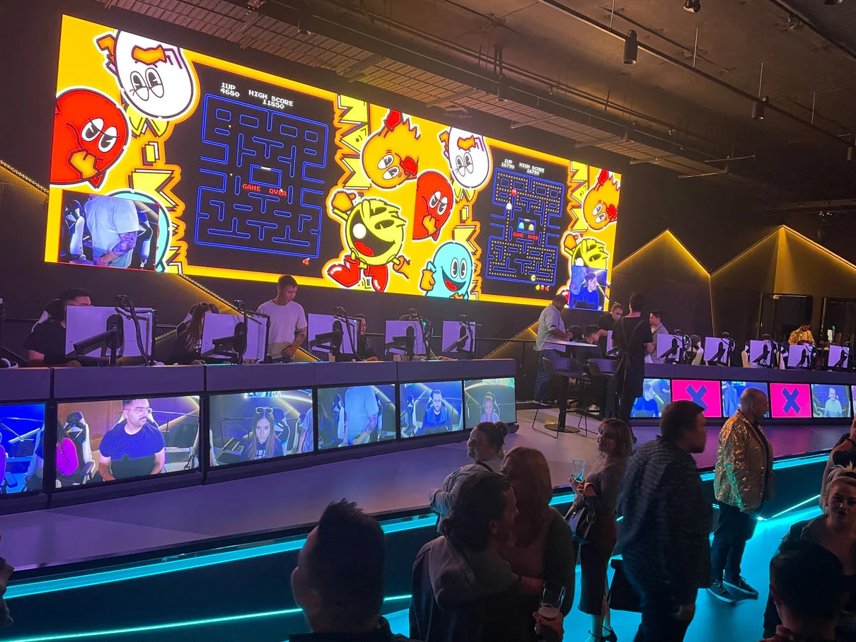 People enjoying competitive Pacman Corporate Games on the Fortress Arena stage PC