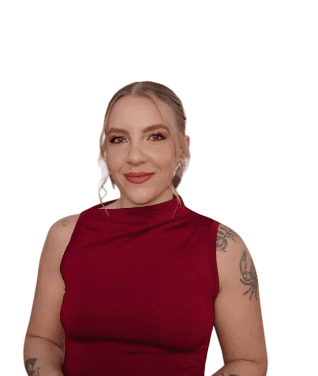 man wearing black crew-neck shirt and black cap in front of glass wall