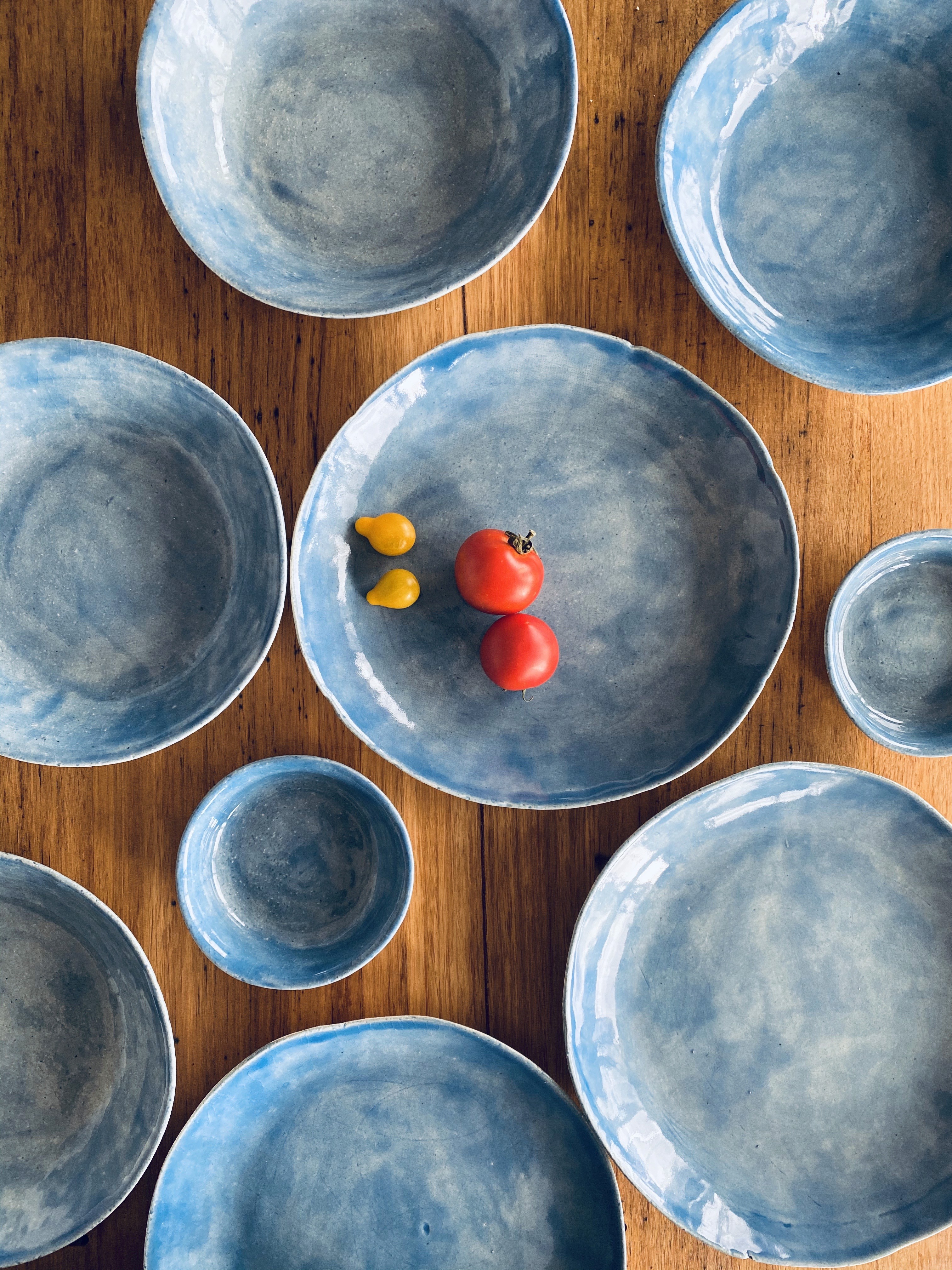 Aerial yoga pose with a woman leaning back in a hammock