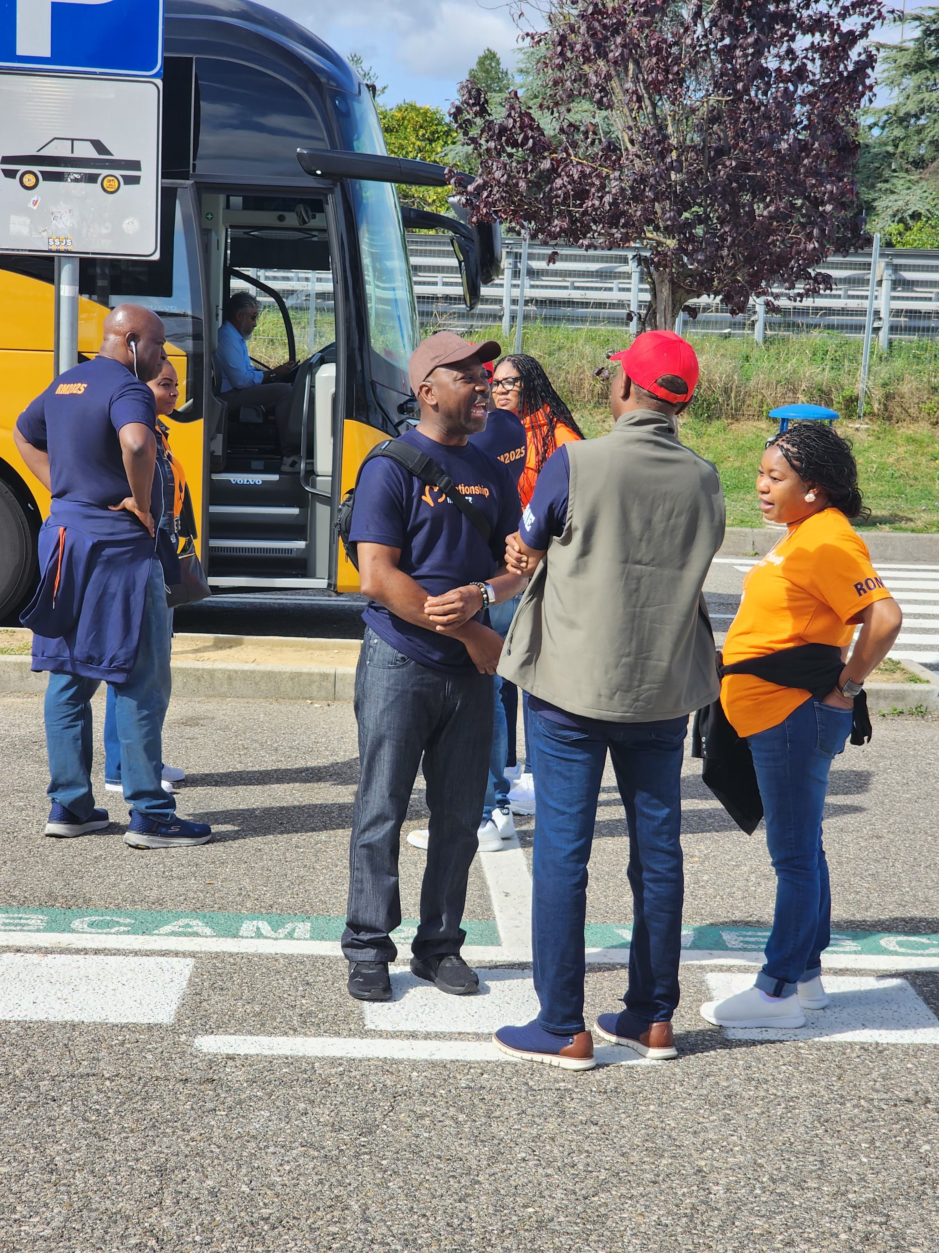 A man stading with Surfboard