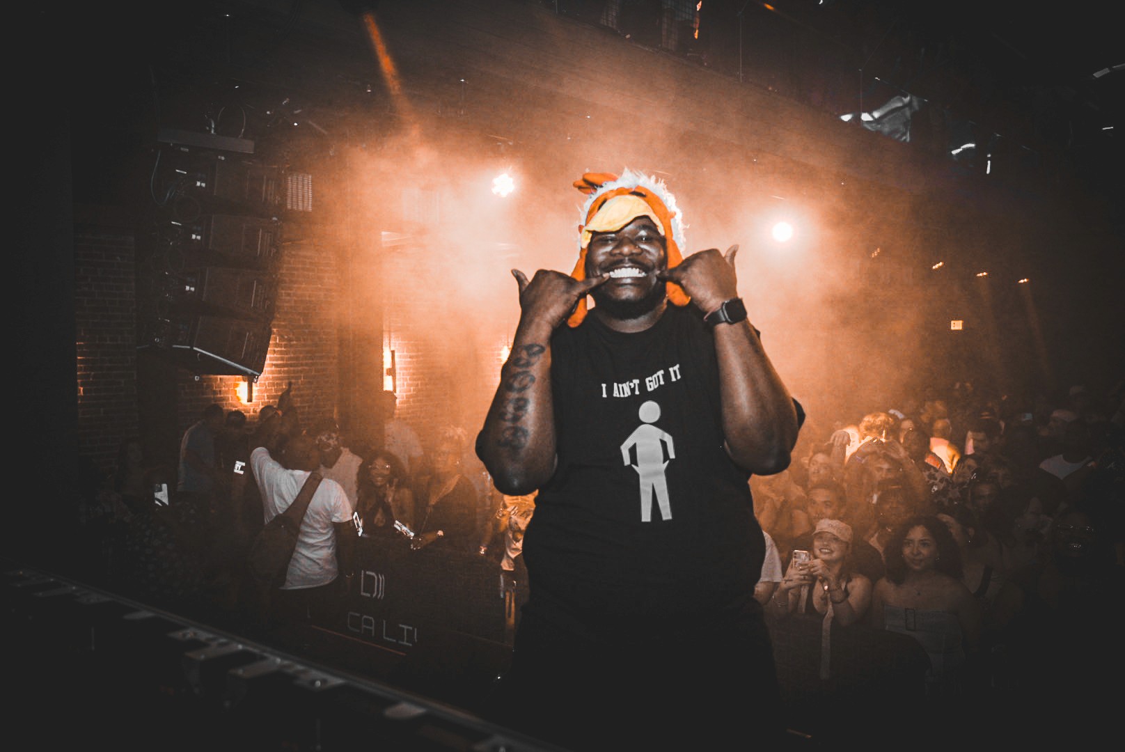 image of a man taking a selfie from a pov while wearing a red sweatshirt