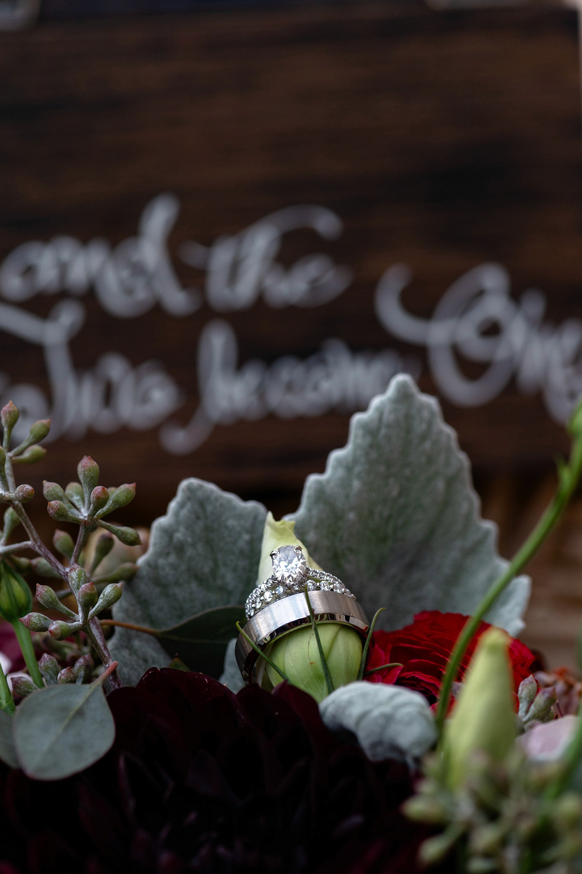 Flat lay wedding details with bouquet, rings, and sparkling bridal heels