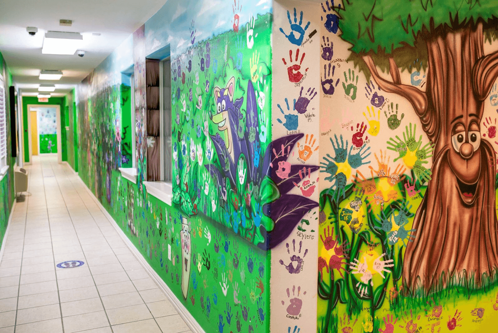 The vibrant interiors of Estrella's House, the CACHSC's Edinburg location. The Child Advocacy Center welcomed its first child in 2001. Since then every child who visits the center has contributed their handprint, name, and age to the walls. With over 22.000 children seen over the last 20 years, wall space is diminishing.