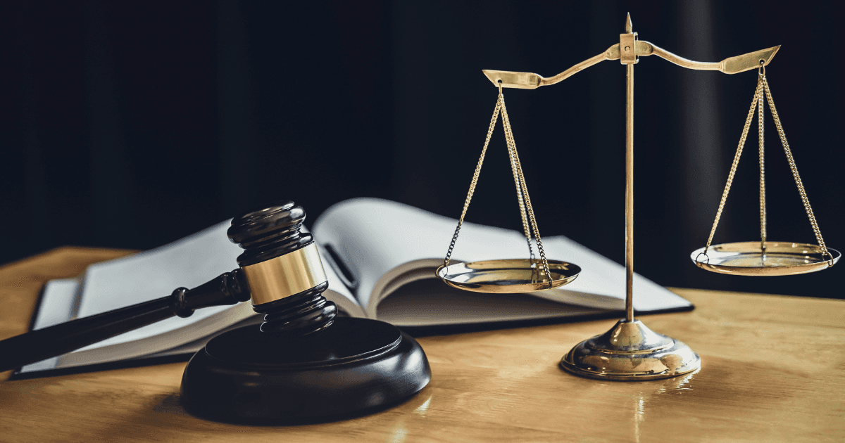Scales of justice or a gavel.