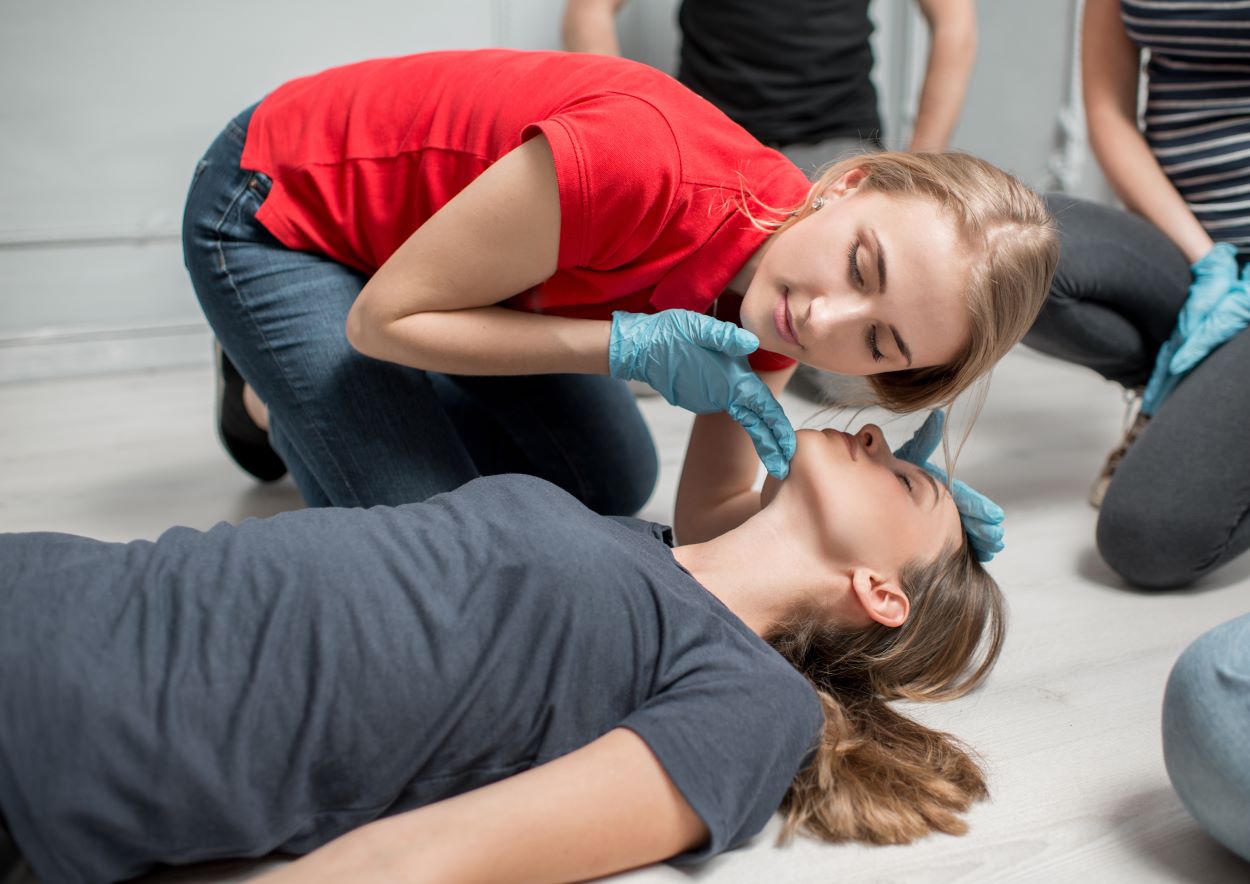 woman in blue t-shirt and blue pants holding baby