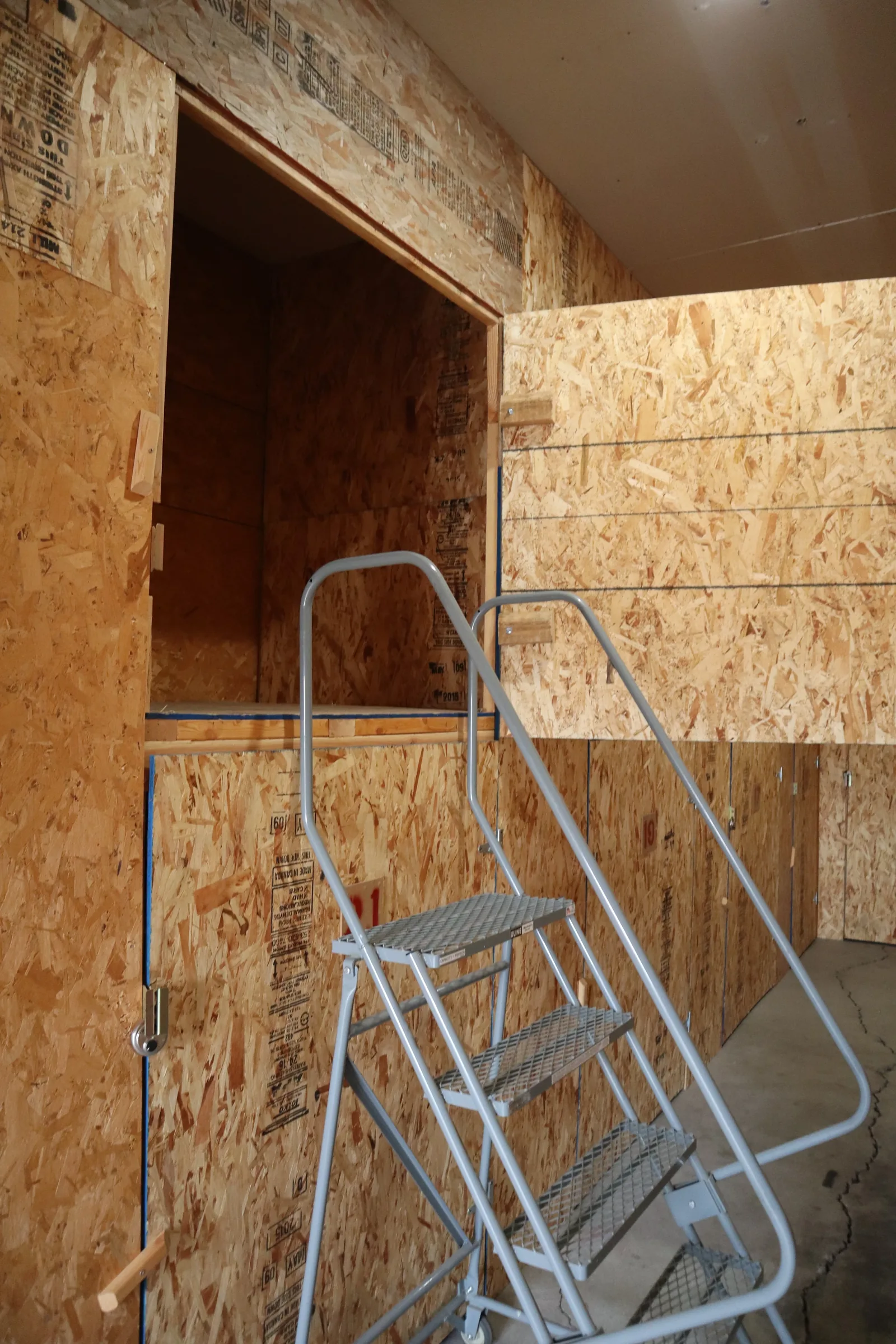 Storage carts inside a wood-paneled storage unit