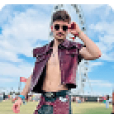 Logan Rago posing confidently at a festival in bold fashion to express individuality, style, and playful energy.