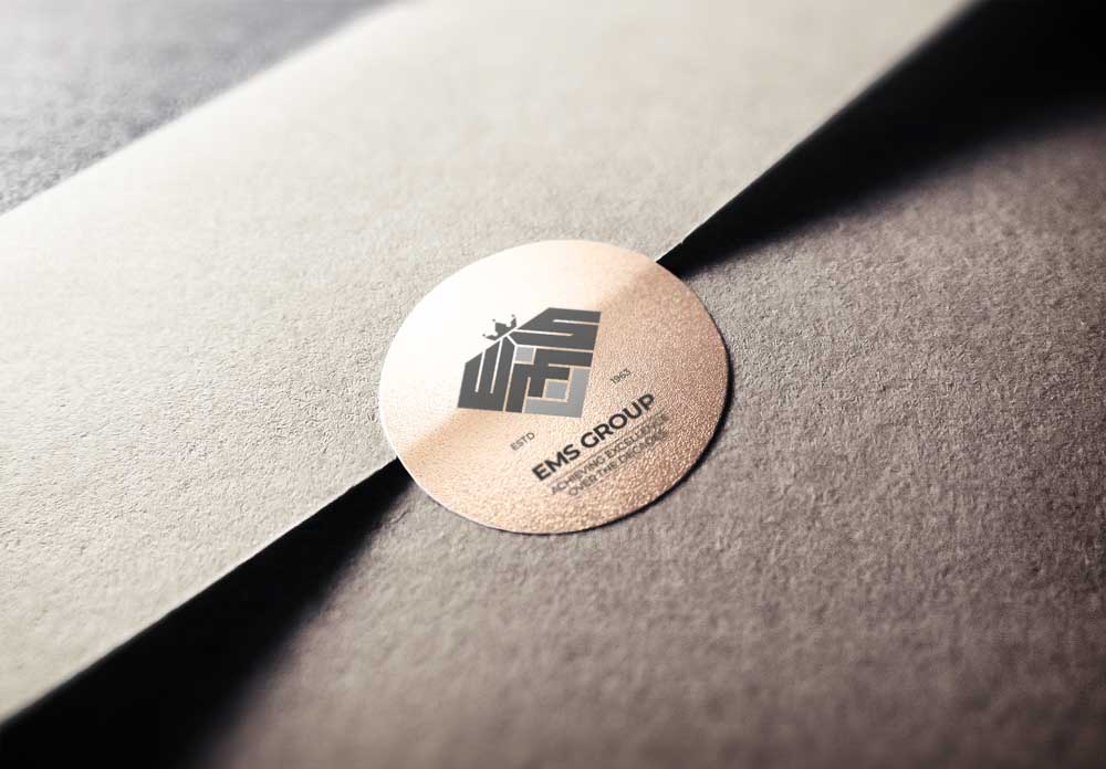 EMS Group logo stamp on luxury packaging — Penguincil Design