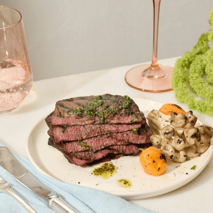 A plate with stake and vegetables.